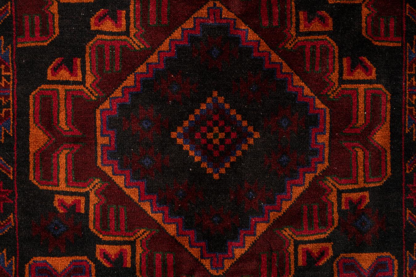 Baluche - East Persia

This magnificent Beluche rug was handcrafted in Eastern Persia in the 1950s. Richly coloured with medallions and tribal geometric figures, this Persian rug stands out due to its strong and striking personality. The carpet is