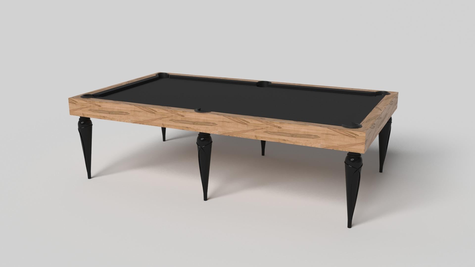 Champagne gold accents add undeniable elegance to this luxury pool table. Offering superior playability and uncompromised style, this design features hand carved details, decorative metal elements, and metal sabots at the bottom of each leg. The