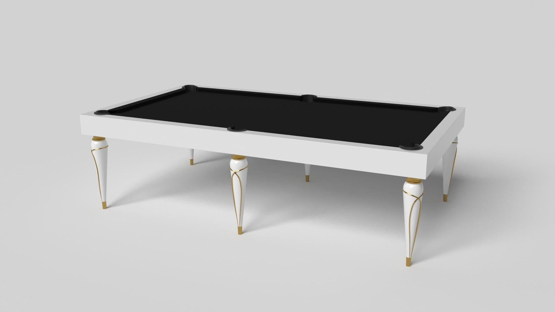 Champagne gold accents add undeniable elegance to this luxury pool table. Offering superior playability and uncompromised style, this design features hand carved details, decorative metal elements, and metal sabots at the bottom of each leg. The