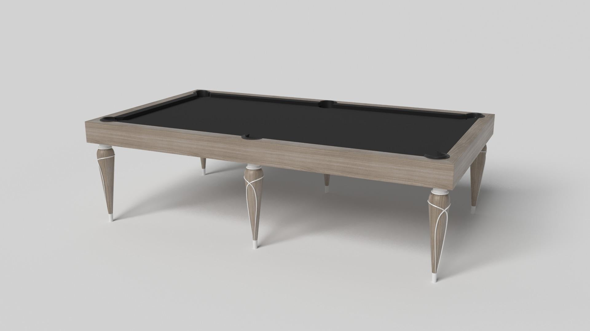 Champagne gold accents add undeniable elegance to this luxury pool table. Offering superior playability and uncompromised style, this design features hand carved details, decorative metal elements, and metal sabots at the bottom of each leg. The