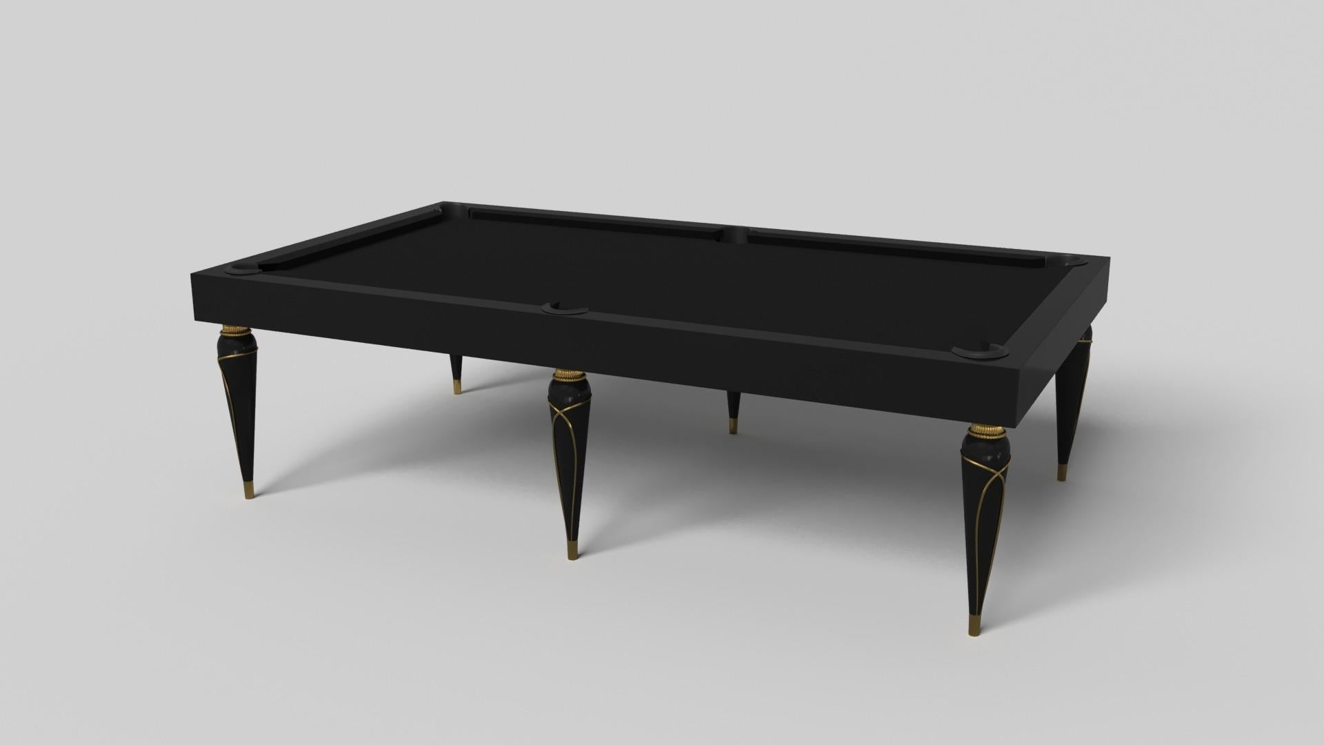 Champagne gold accents add undeniable elegance to this luxury pool table. Offering superior playability and uncompromised style, this design features hand carved details, decorative metal elements, and metal sabots at the bottom of each leg. The