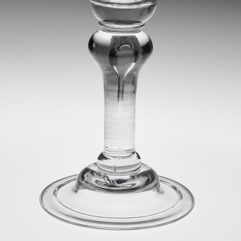 Baluster Wine Glass with Domed Foot, c1725

Another myth busting glass. The bowl has a greater diameter that the folded foot.

Additional information:
Period : George II 1720-1730
Origin : England 
Colour : Clear. Blue-grey tone
Bowl : Bell