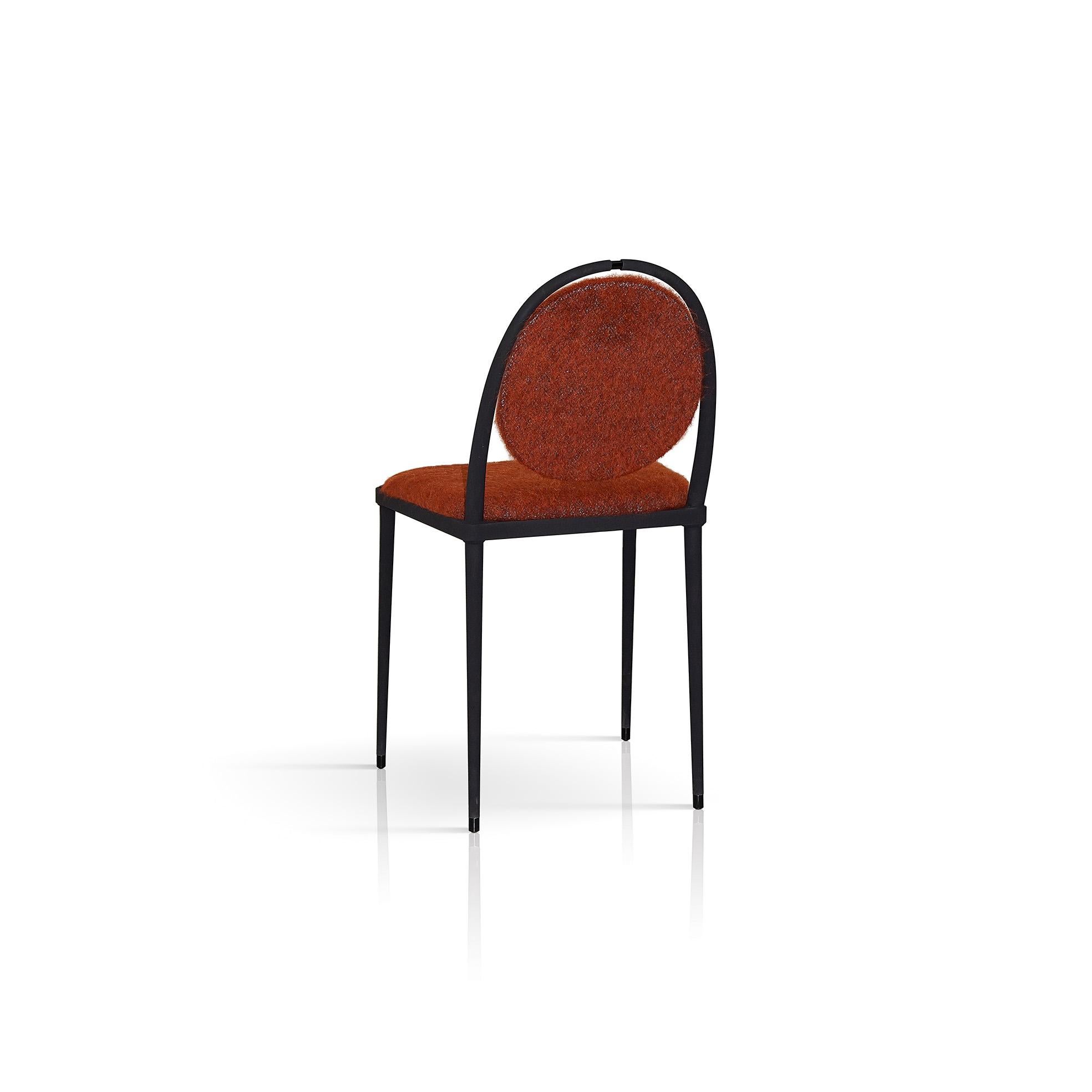 Part of the Balzaretti series, this chair reflects the traditional values of Italian craftsmanship reinterpreted in a light and modern design of great visual harmony. Stunning in its simplicity, the matte black metal frame features slender legs and