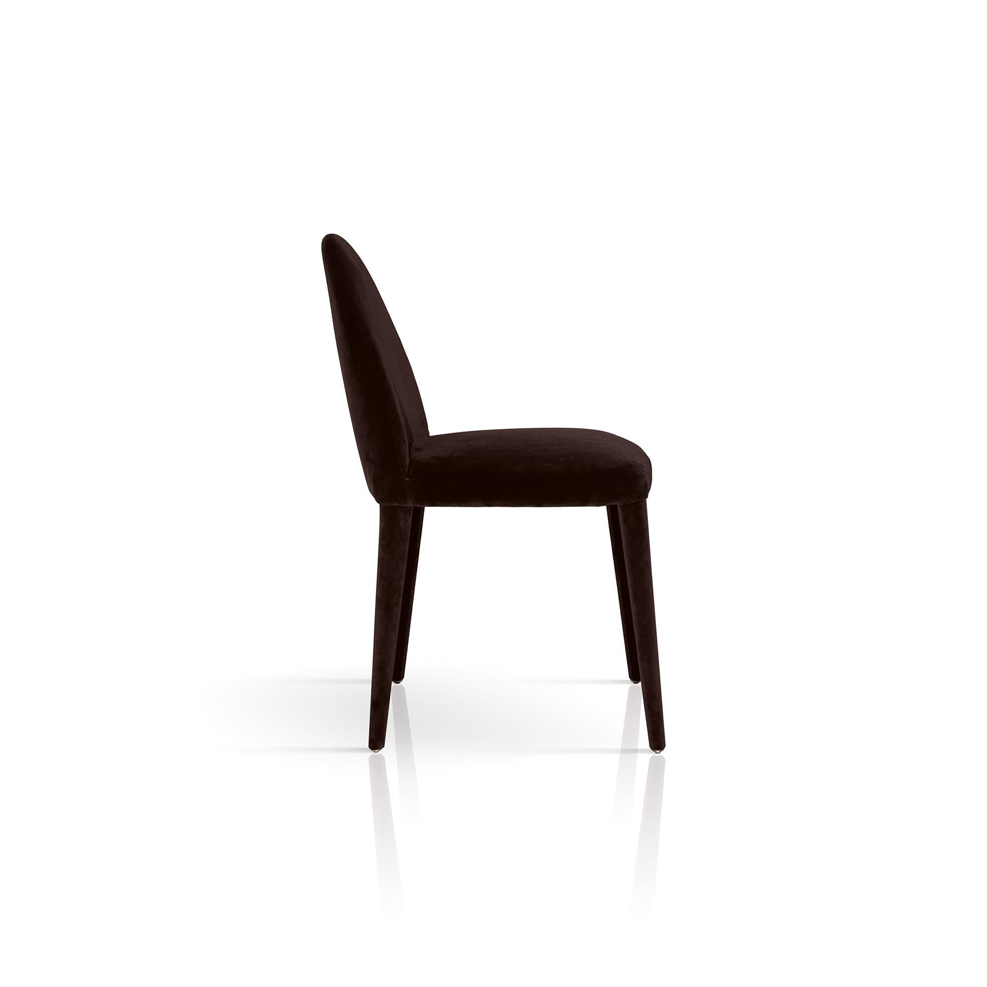 Timeless charm and simple elegance set this chair apart. Entirely upholstered in mocha brown velvet, this design is a perfect balance of modern materials and classic shapes, featuring slender legs with brass ferules, rounded backrest, and a spacious