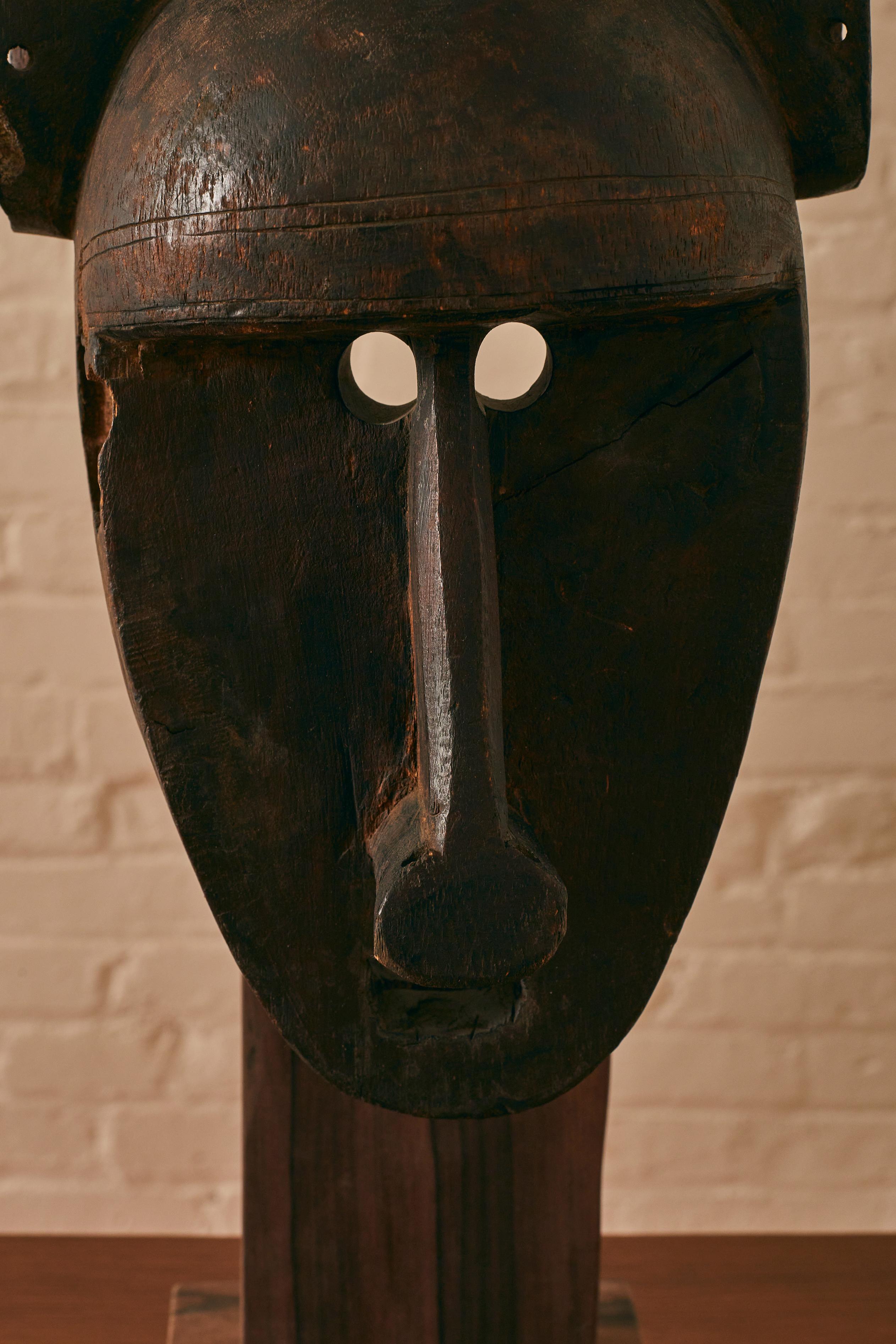 Hand-Carved Bamana Mask on a Custom Wooden Stand For Sale