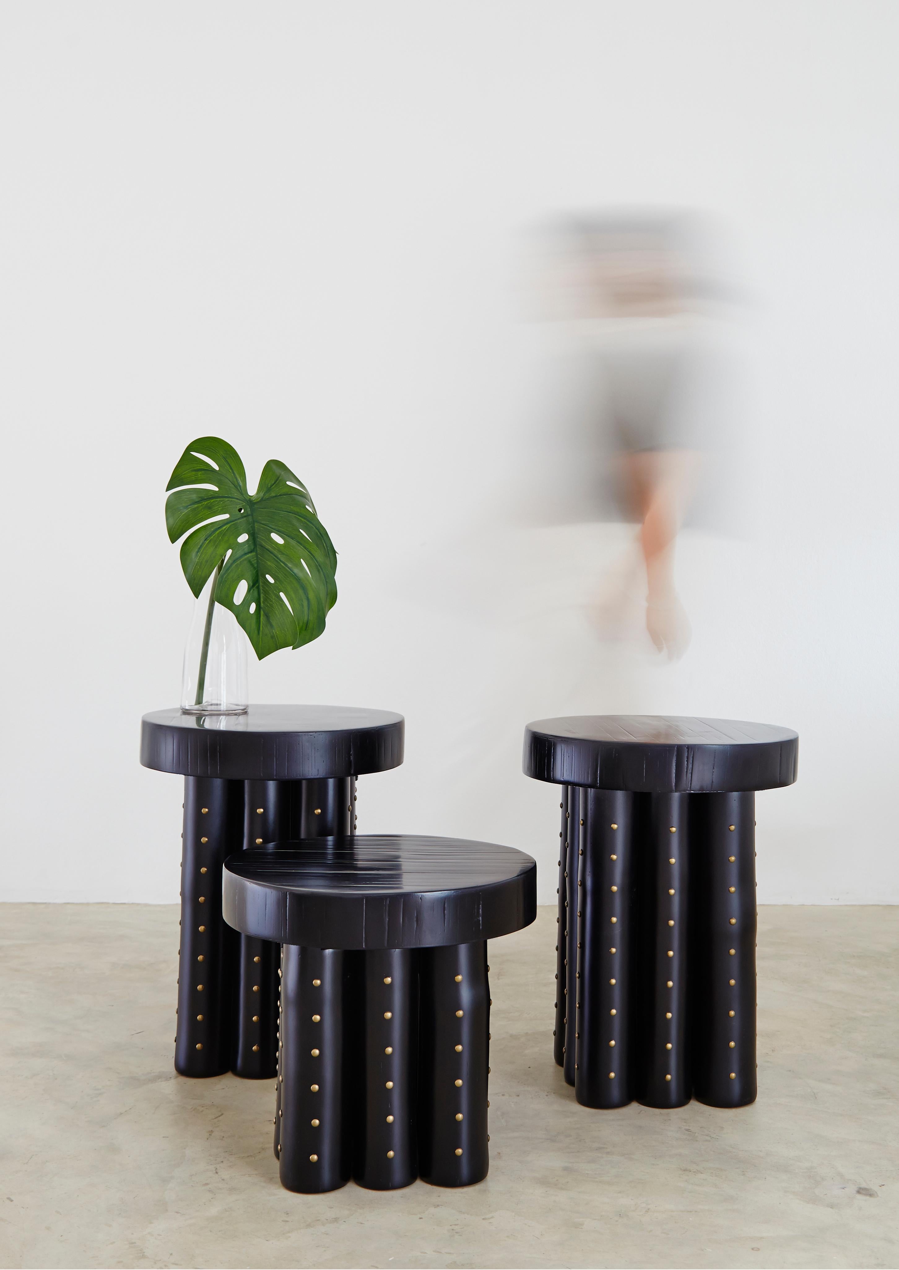 Bamba is an ode to bamboo. Gathered in strength and though covered in black, the organic nature still shines through honoring the materiality of the tree. The top portion was created using the same traditional wall-making technique learnt from the