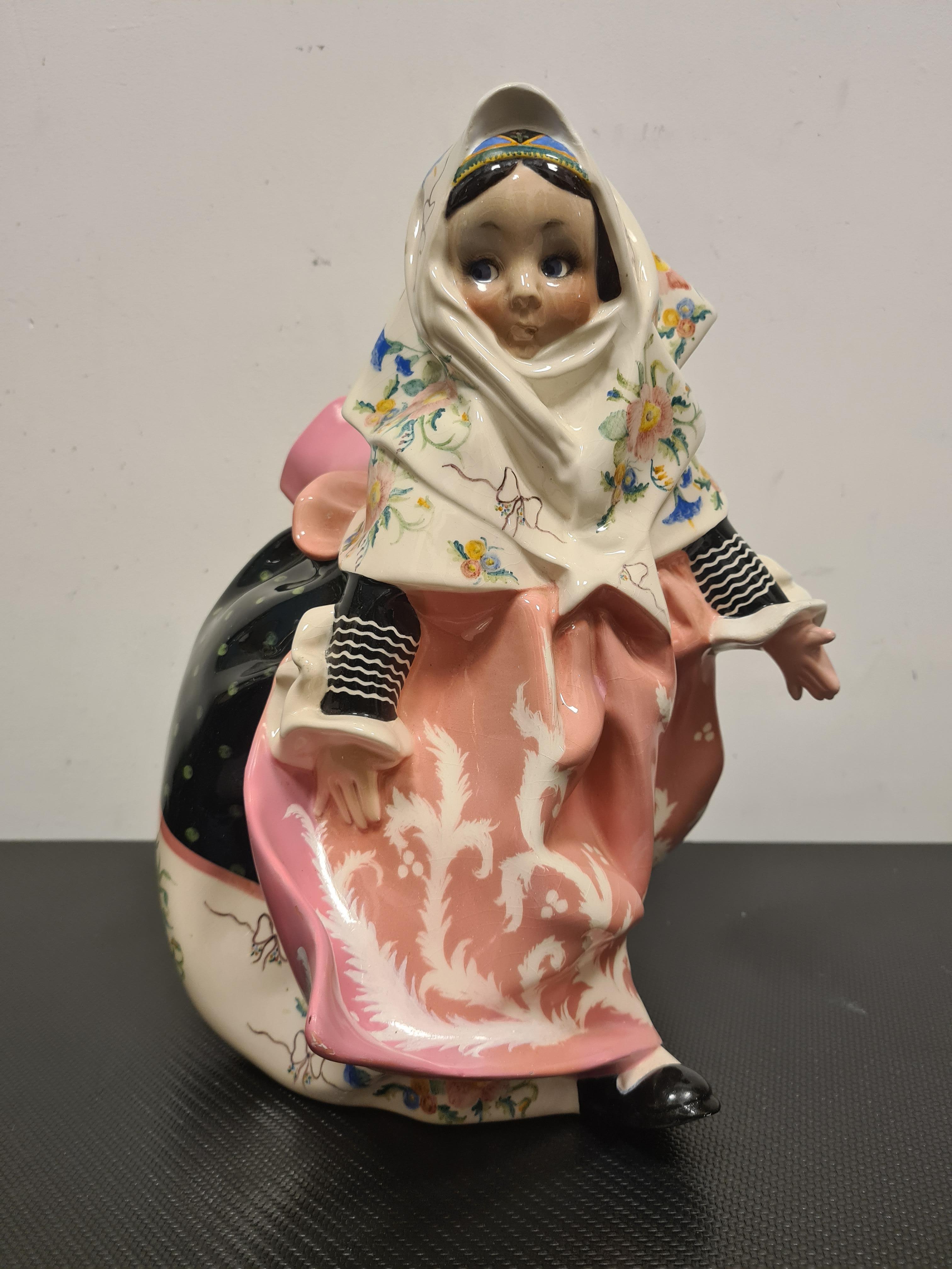 Ceramic depicting little Sardinian girl designed by Sandro Vacchetti.

Delightful ceramic statue depicting sweet little girl in traditional Sardinian dress.

The work is model No. 254 and was designed by Sandro Vacchetti for Essevi.

This one in