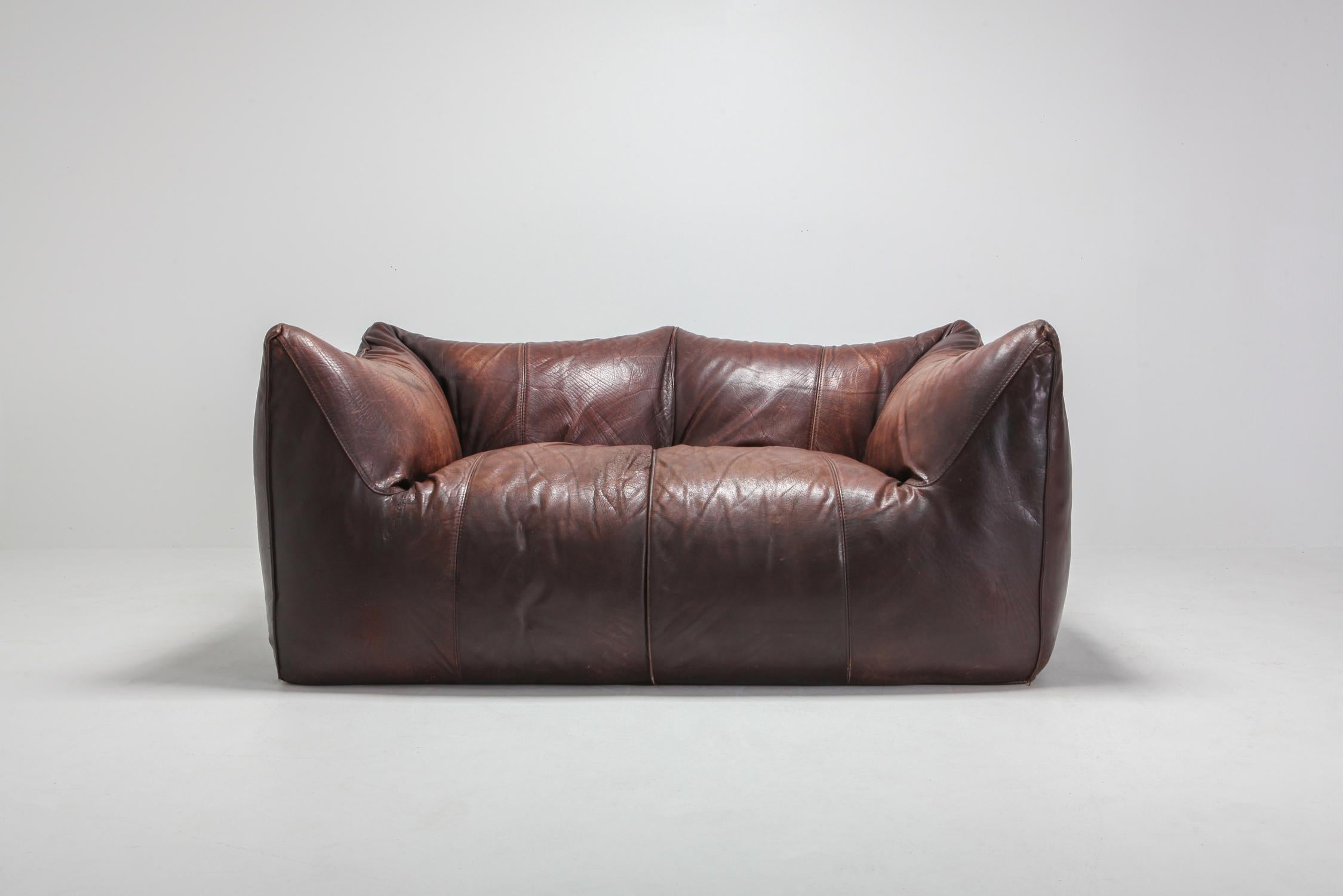 Mario Bellini for B&B Italia, 'Le Bambole' sofa, brown patinated leather, Italy, 1972. 

This piece is one of the very rare prototypes or early editions, and still 100% original, read on.

In the Bambole, the piece is reduced to an archetypical