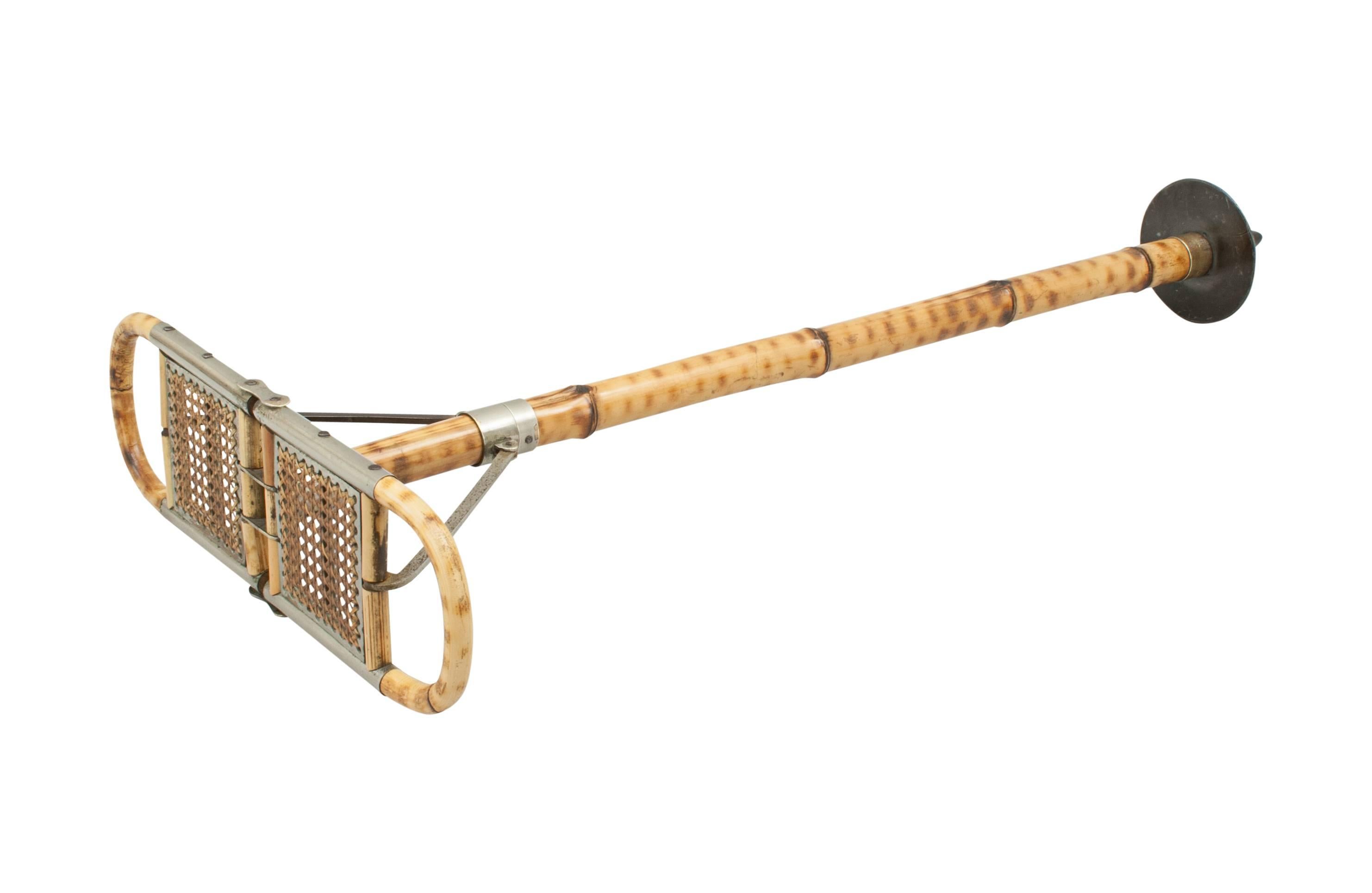 Antique bamboo shooting stick.
A good quality sports seat, shooting stick made of bamboo with folding cane seat and polished brass fittings. There is a metal disc on the bottom to support the seat in soft ground. The stick is in very good original