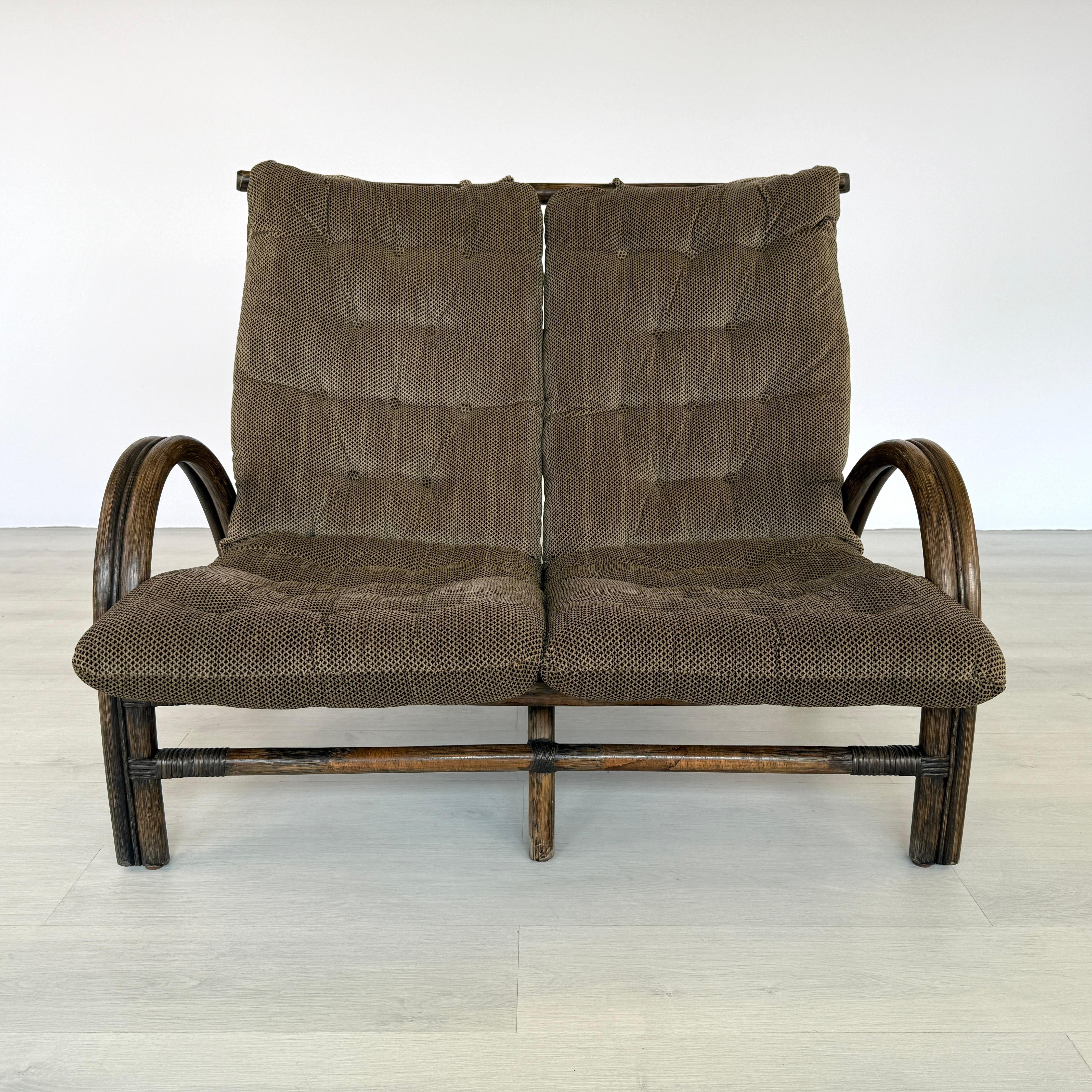 Dimensions: H 38” x W 46.3” x D 37.7” x SH 16”

Vintage bamboo and rattan two-seater sofa manner of Rohe Noordwolde. Upholstered in original brown fabric. Very comfortable and stylish. Wicker, cane and rattan furniture is ideal for a conservatory,
