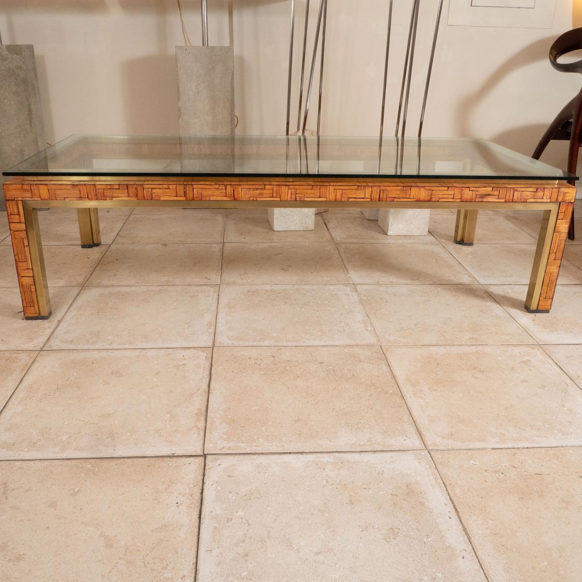 Bamboo and brass coffee table with glass top.