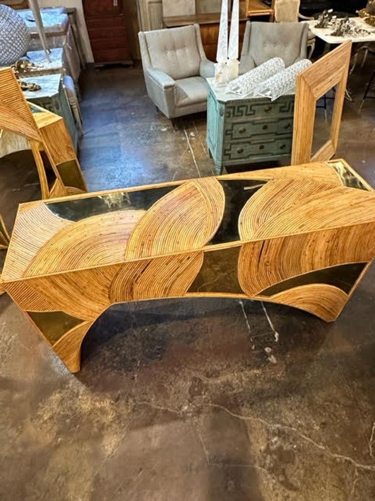 Handsome bamboo and brass consoles. A very unique piece that makes an interesting statement!! Note: There are 2 available.  Priced separately.