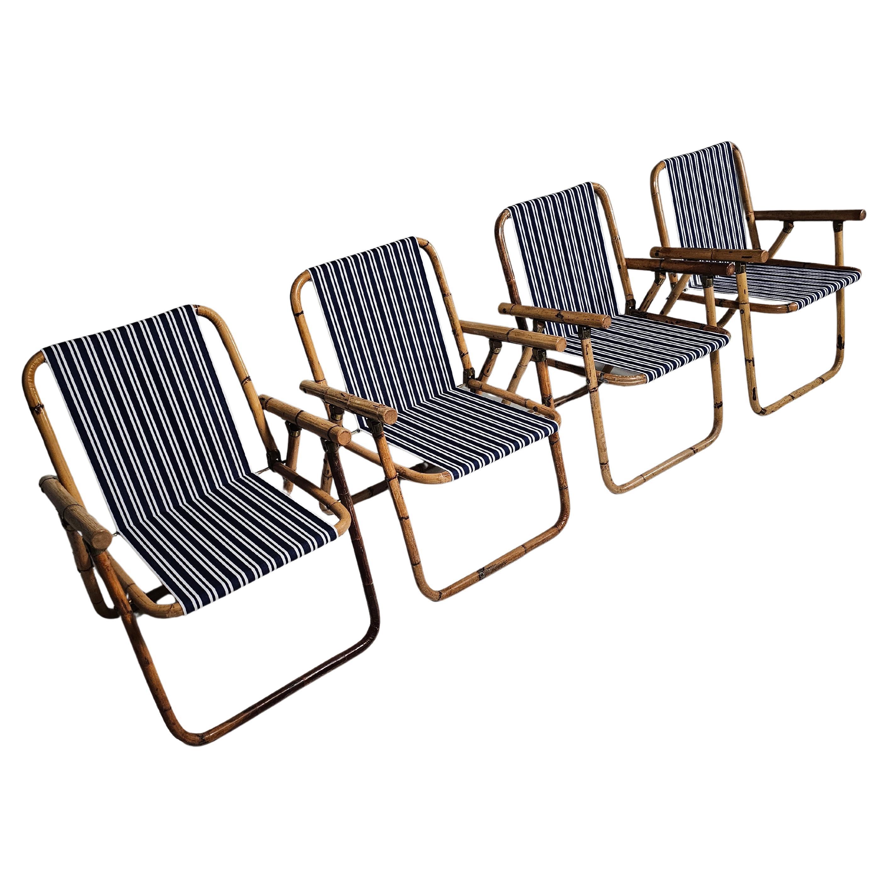 Set di 4 sedie Foldes in bambù e ottone degli anni '60 attribuite a Vivai del Sud. 

Their unique folding design makes them perfect for spaces that require adaptable seating solutions, easily stowing away when not needed. This feature, combined with