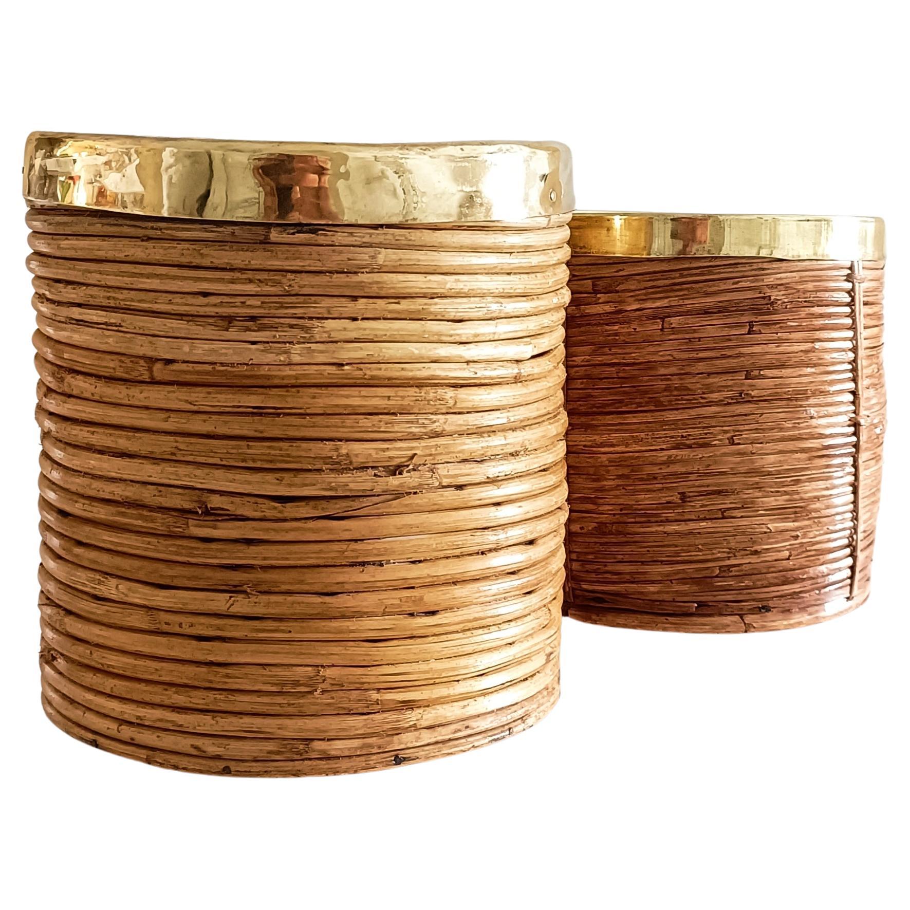 A gorgeous pair of rattan and brass planters in the manner of Gabriella Crespi. Handmade in Italy circa the 1960s/1970s.

Crafted with handwoven rattan and accented with polished brass, these planters are perfect for showcasing your favorite plants.