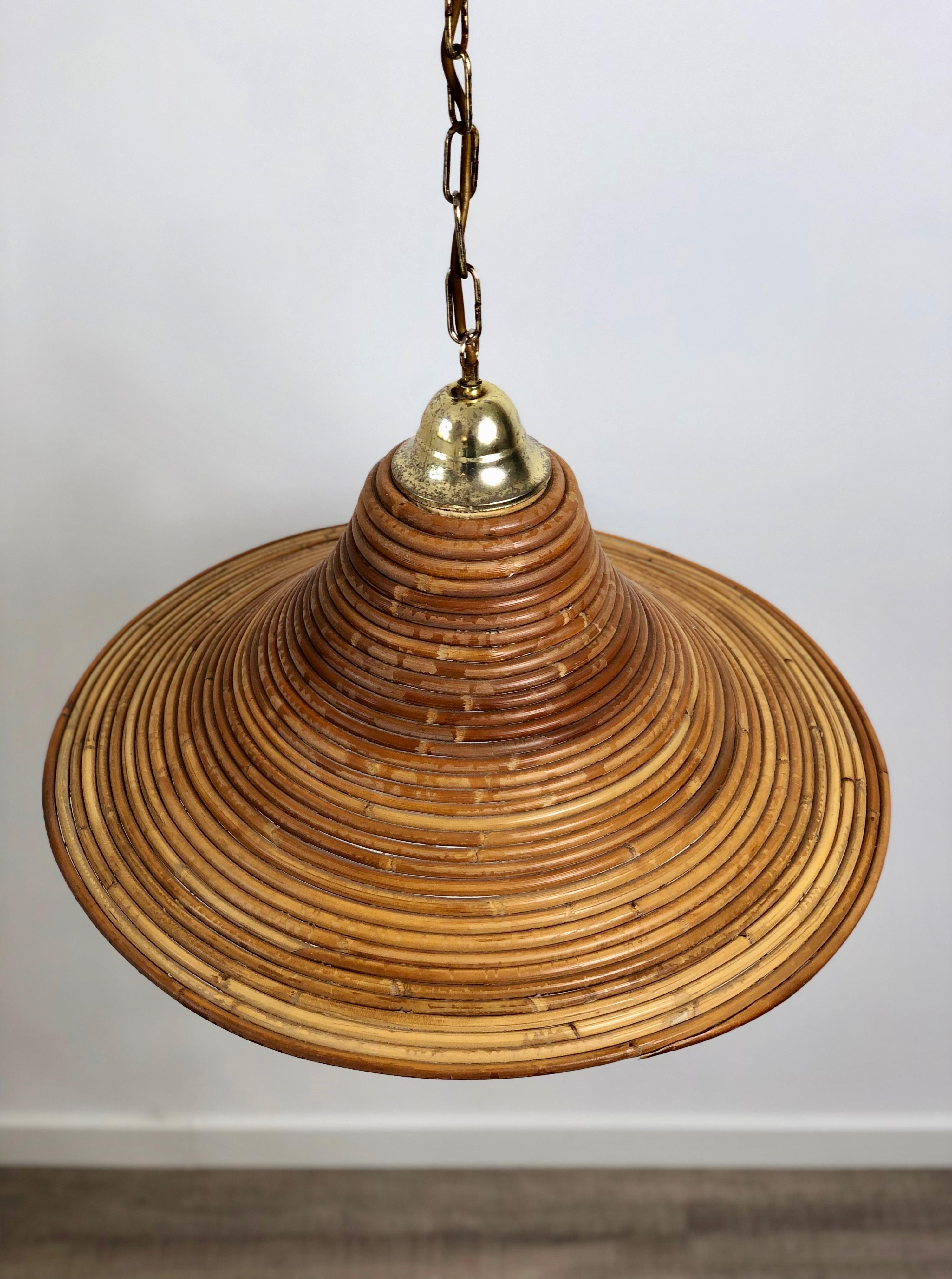 Beautiful midcentury pendant lamp handcrafted in Italy. This lamp is a striking appearance in any room. It is a perfect representation of the 1950s period because of its design, quality and functionality. 
The lamp is made of bamboo and polished