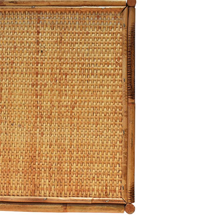Scorched Bamboo or what is also commonly referred to as tortoise or tiger bamboo, breakfast tray, lap or bed tray. This lovely 1930s piece is composed of rattan, bamboo, and cane. The top portion where food is served is covered in a woven cane