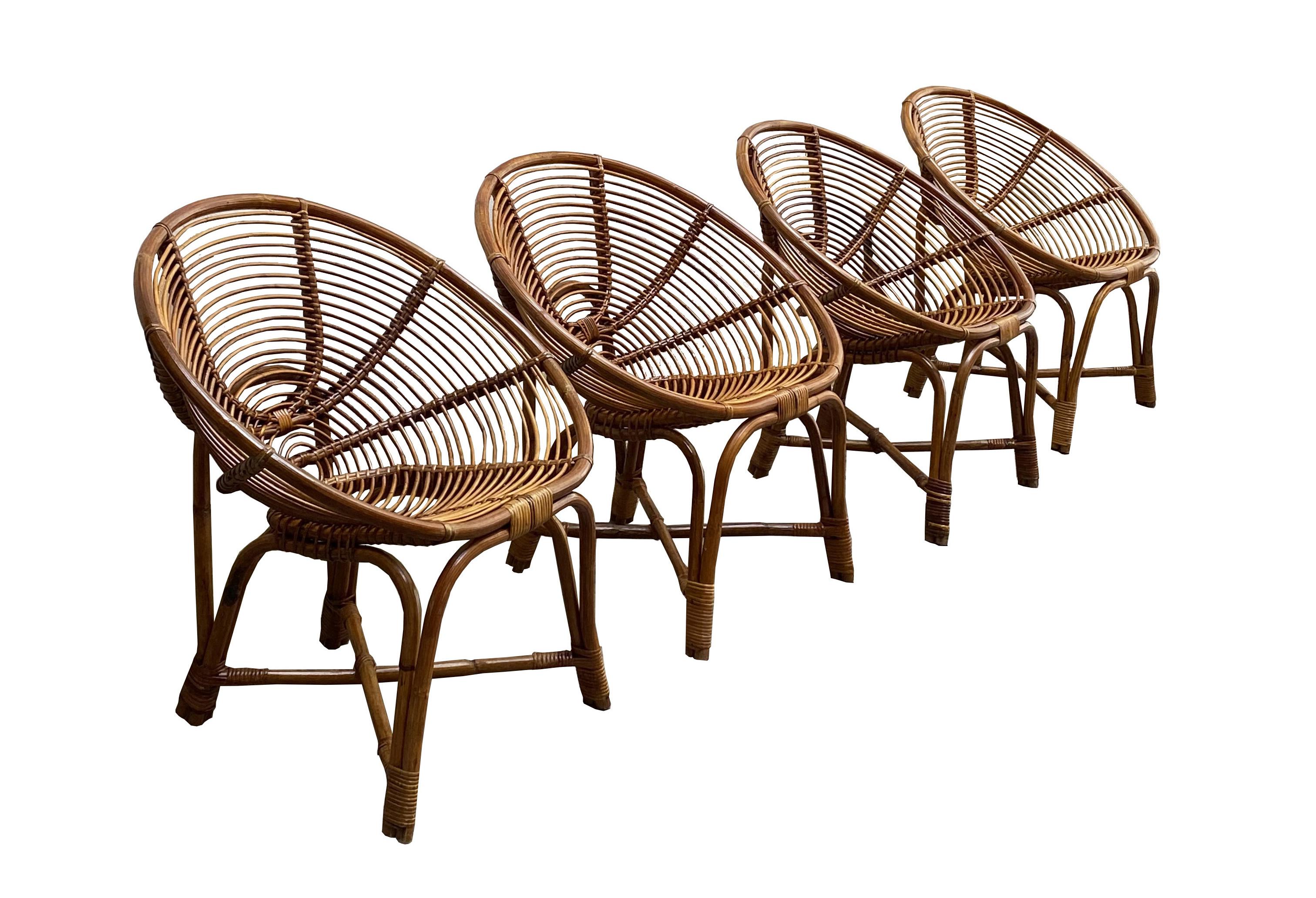 Set of 4 armchairs made of cane and bamboo and a round coffee table with cane and bamboo frame and glass top. Italian production 1960
Armchair size cm. H.72X70X50
Coffee table size cm.. H.50X67X67