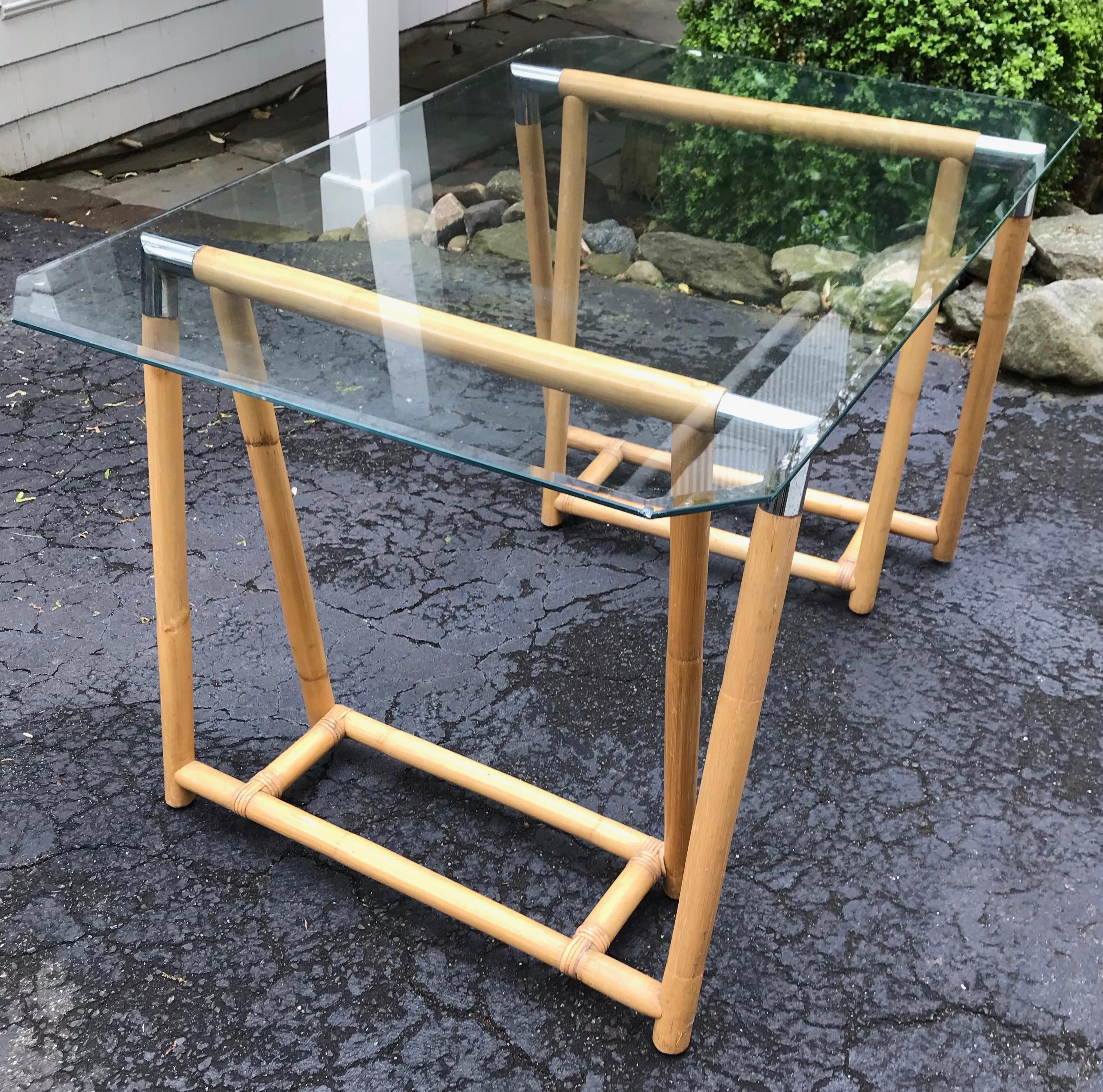 Bamboo and chrome sawhorse table. Pair of large bamboo sawhorse bases in the manner of McGuire with inset interior stretchers and gleaming chrome cap rests with octagonal glass top for a chic single home desk or a larger top fitted as a dining
