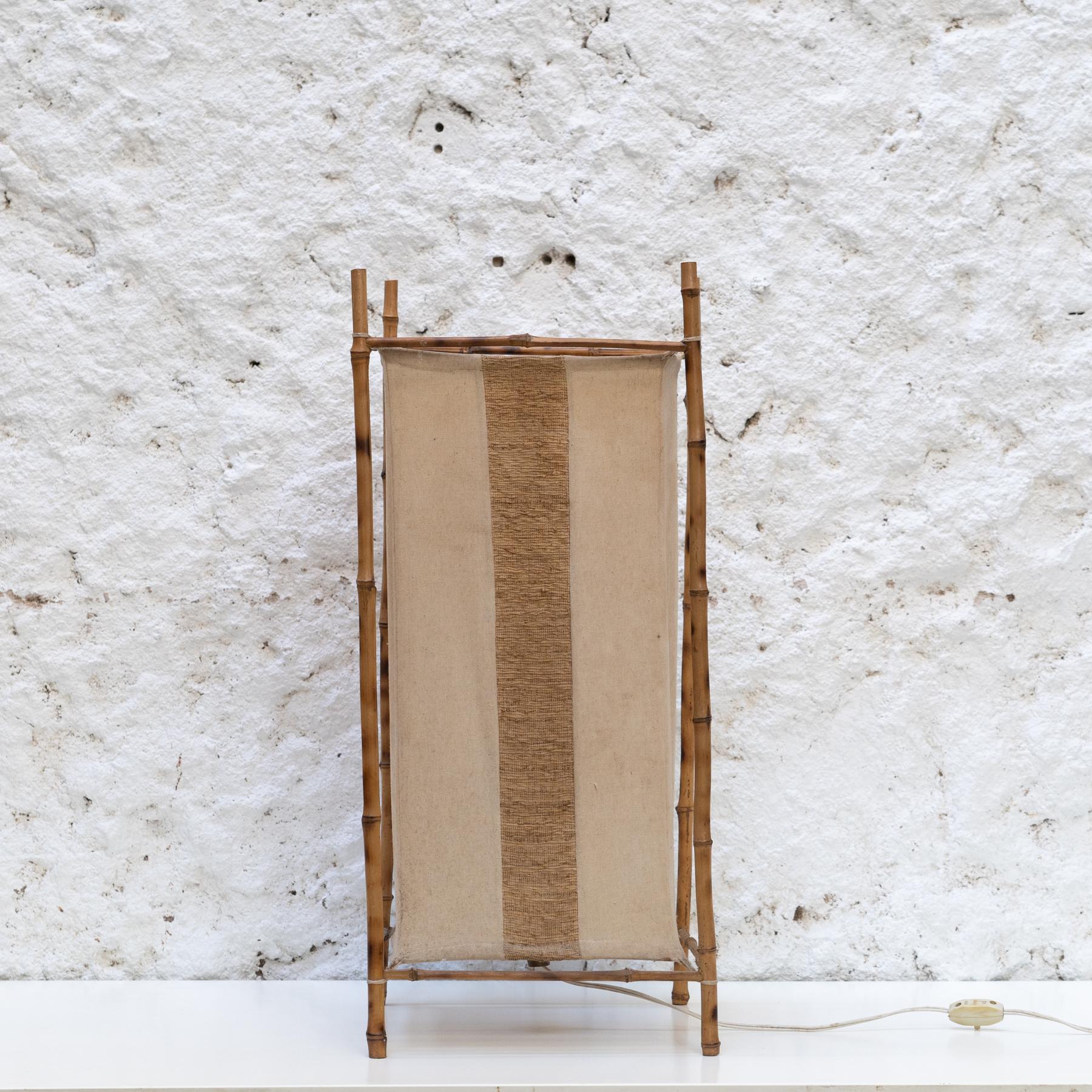 French Bamboo and Fabric Lamp in the Style of Louis Sognot

Designer: In the style of Louis Sognot

Origin: France

Year: Circa 1960

Medium: Bamboo frame with fabric shade

Condition: Original condition with minor wear consistent with