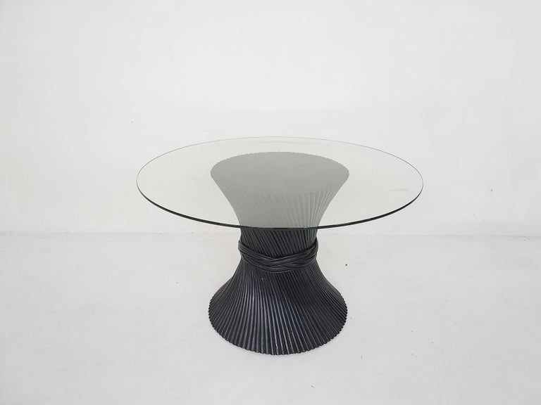 Black bamboo dining table with glass top.
The glass has a small (inside) crack at the edge.