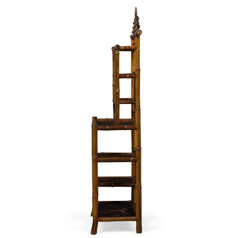 The bamboo and lacquer etagere with a pagoda shaped top combines natural elements with intricate craftsmanship evoking  an Asian architectural style. Bamboo, known for its strength and flexibility, forms the primary material of the etagere. The
