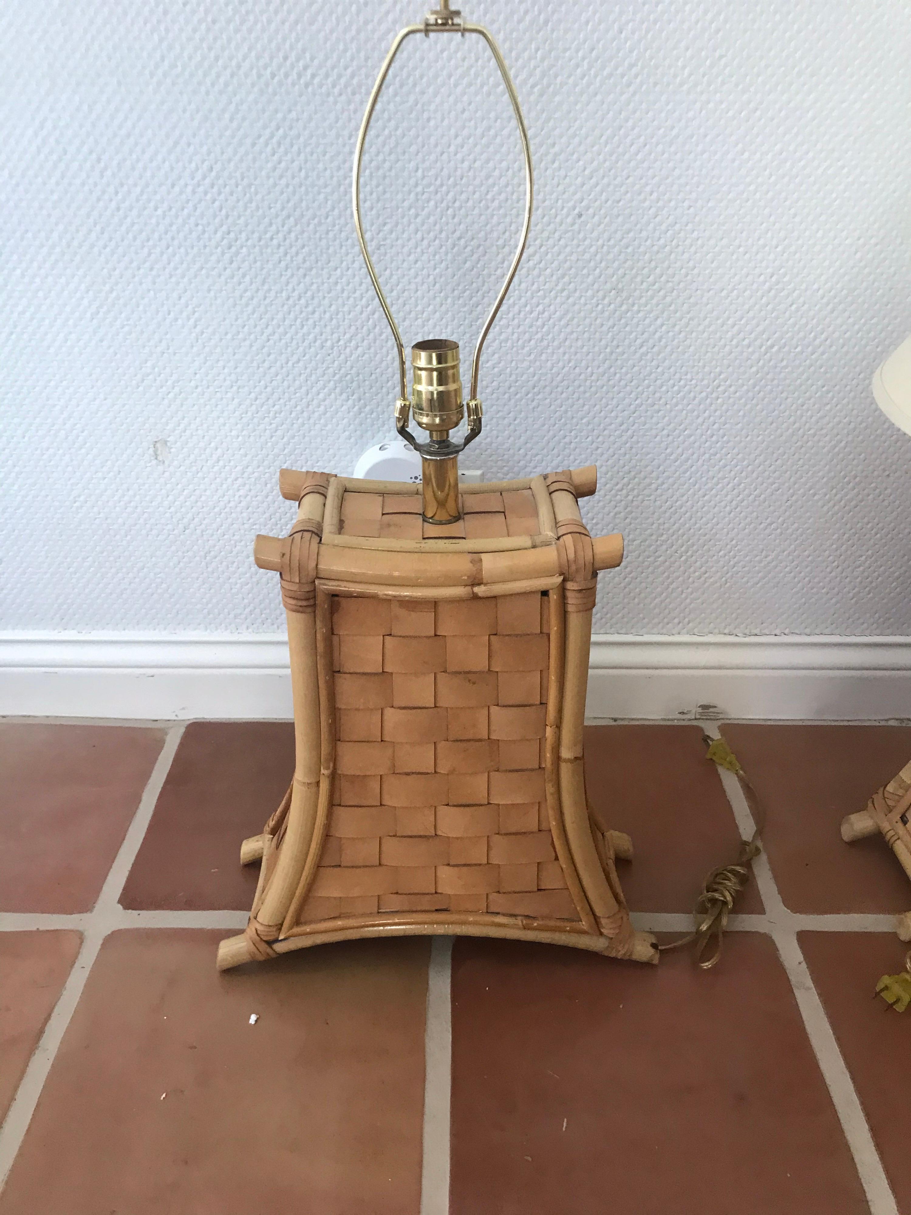 This is a pair of vintage bamboo and leather strap lamps, probably from the 1970s-1980s.
The lamps are in great condition and have a Hollywood Regency feel.
