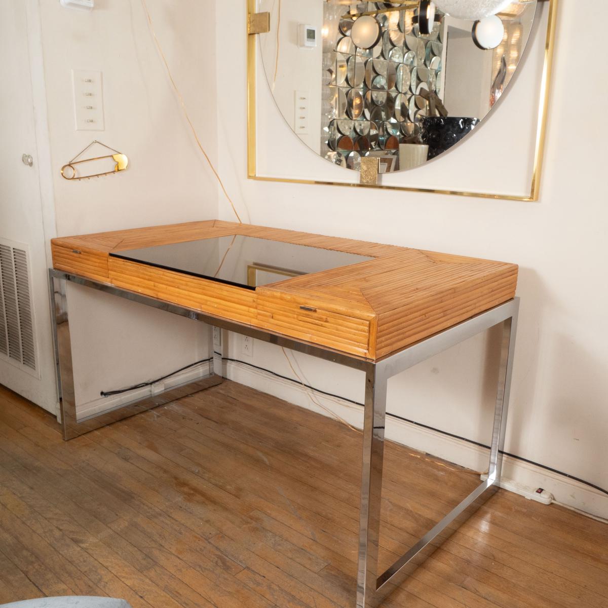 Bamboo and polished nickel two drawer desk with smoked glass top. 