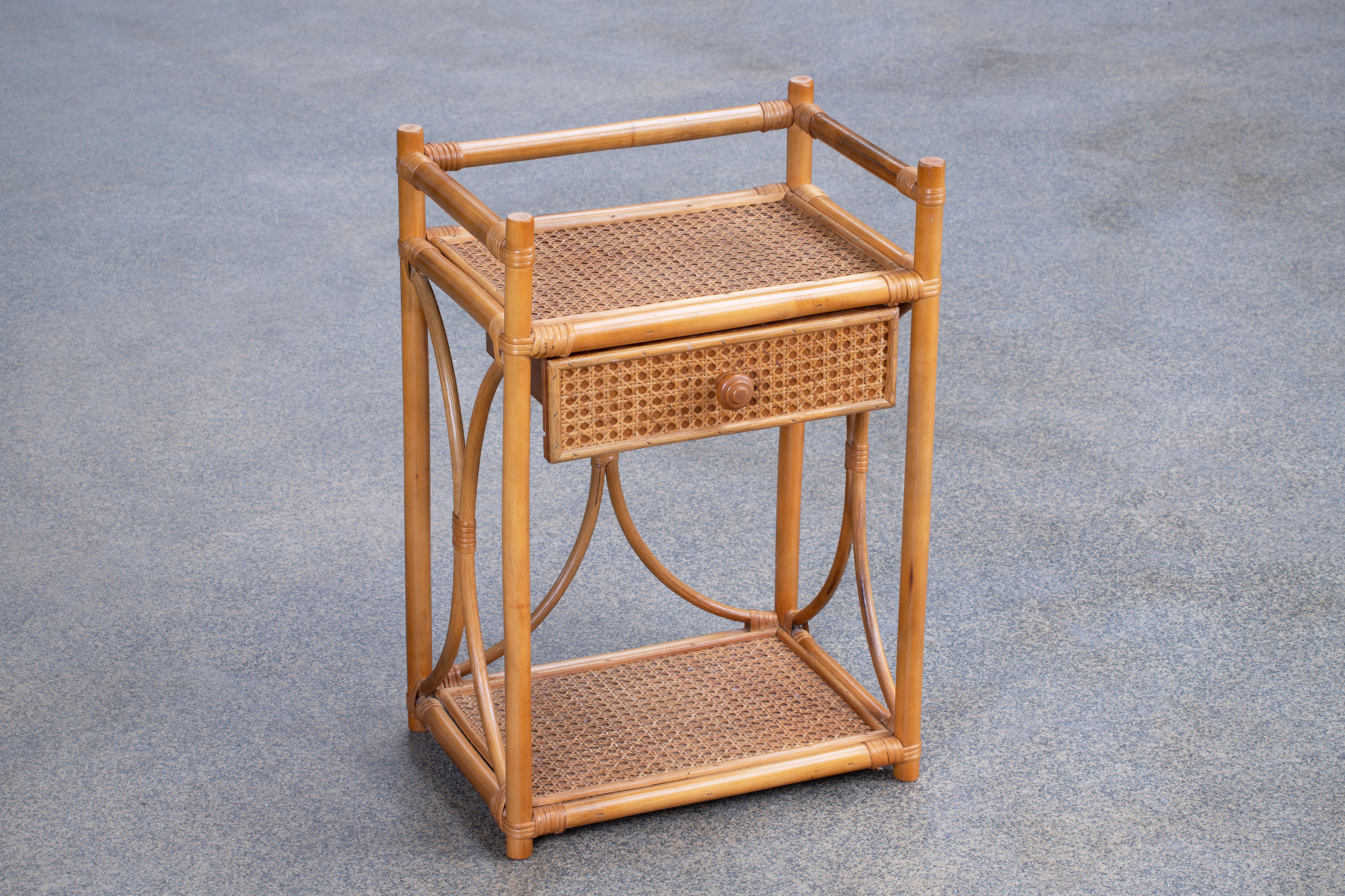Amazing midcentury bamboo, Rattan single drawer end or side table. 
This wonderful piece was designed in Italy during the 1960s.

A fantastic item that will be a perfect addition in order to complete a midcentury studio or a bedroom.

In the manner