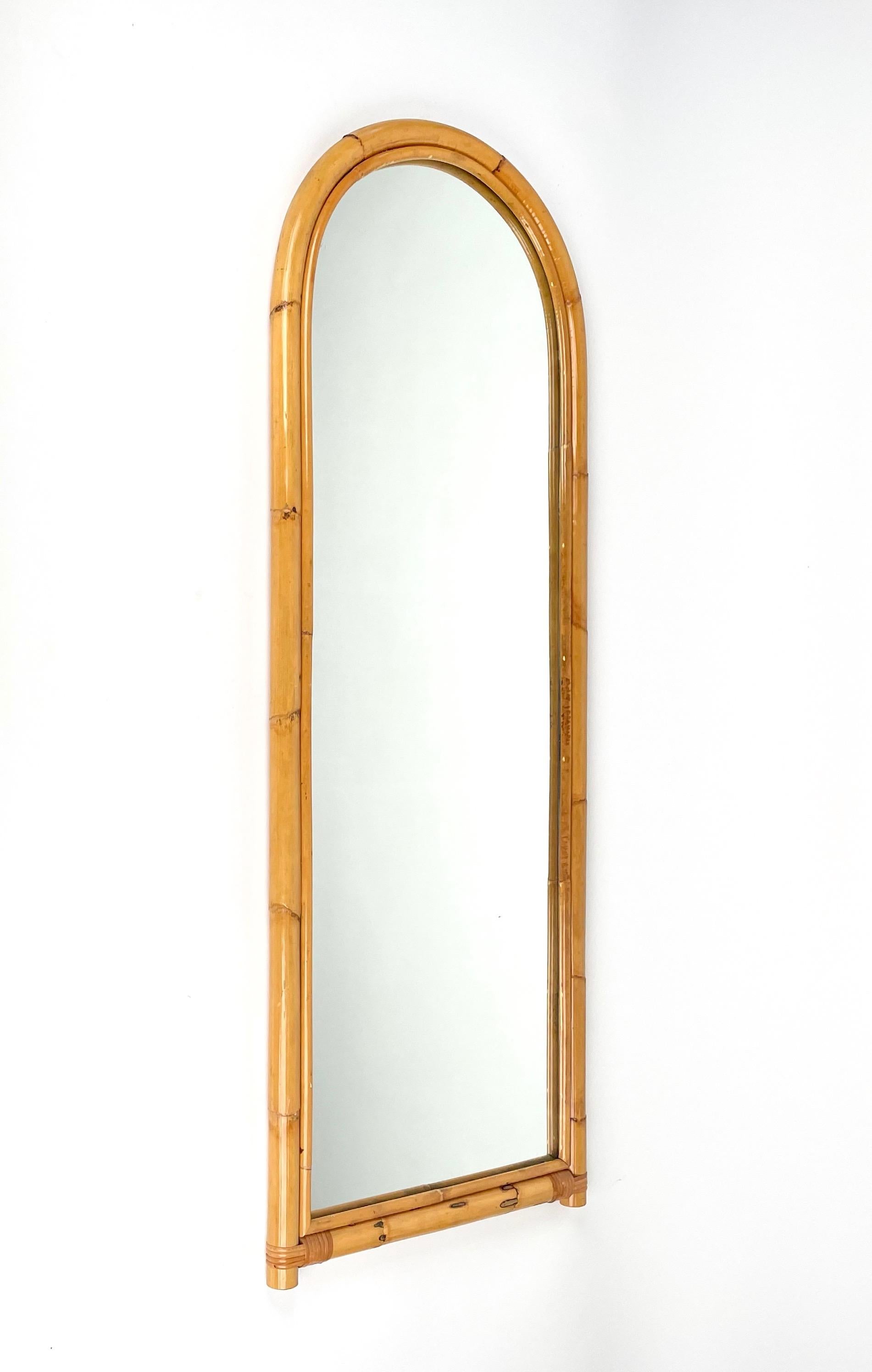Bamboo and Rattan arched wall mirror.

Made in Italy in the Italy 1970s.