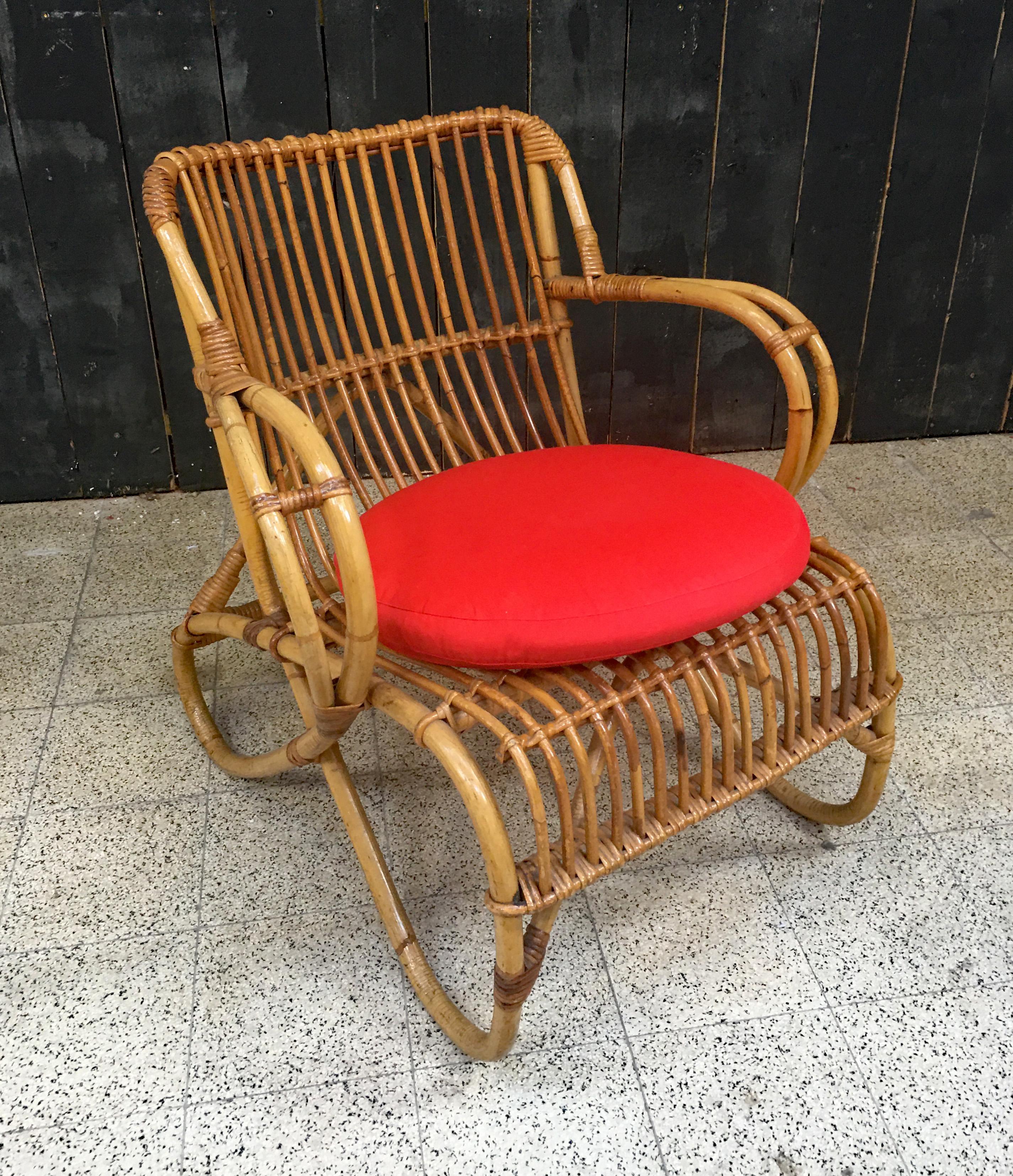 Bamboo and rattan armchair and its cushion circa 1970.

Good condition.