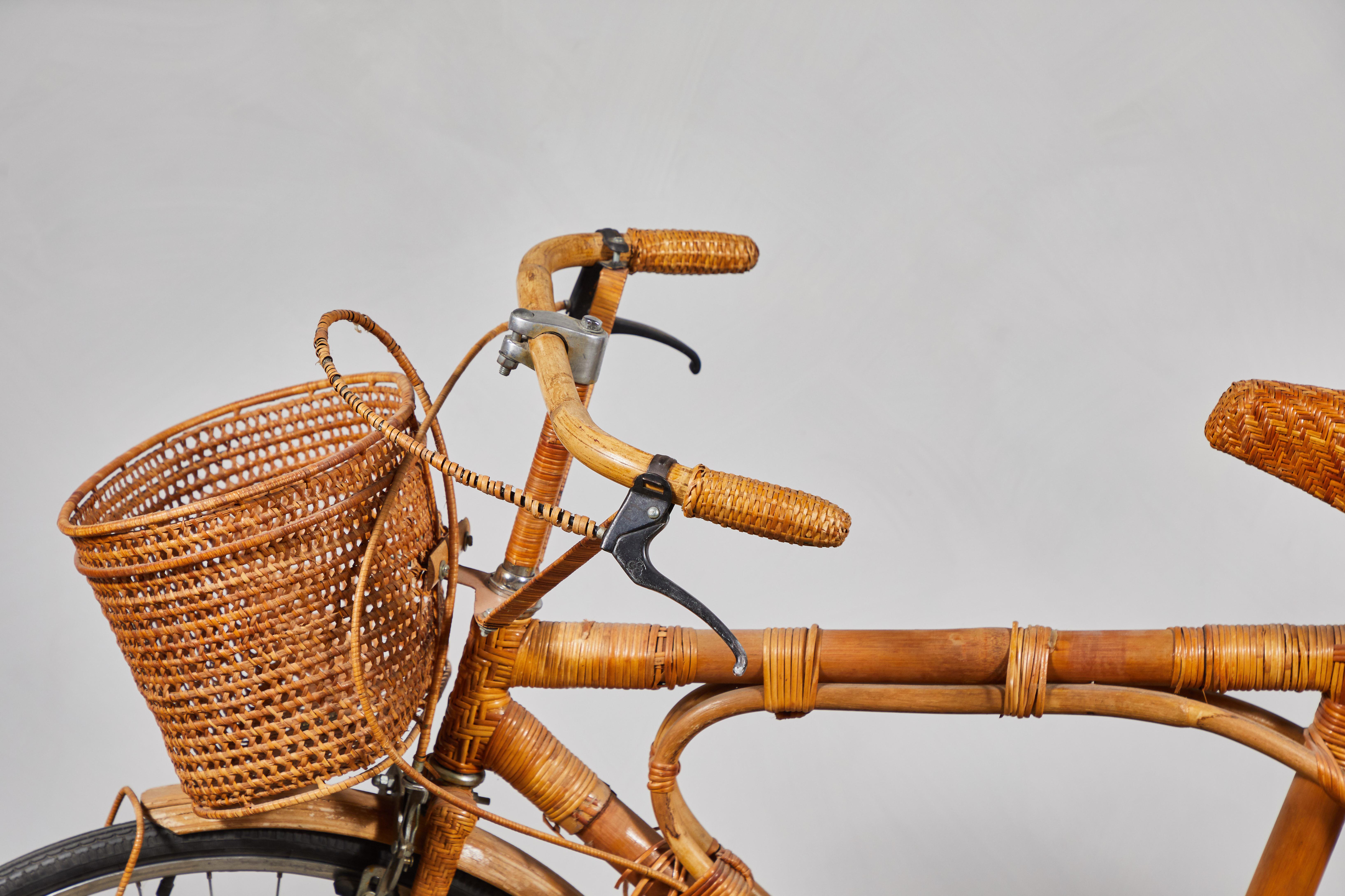 Fun vintage bamboo and rattan bicycle from in great vintage condition. Includes attached basket, luggage rack..

 