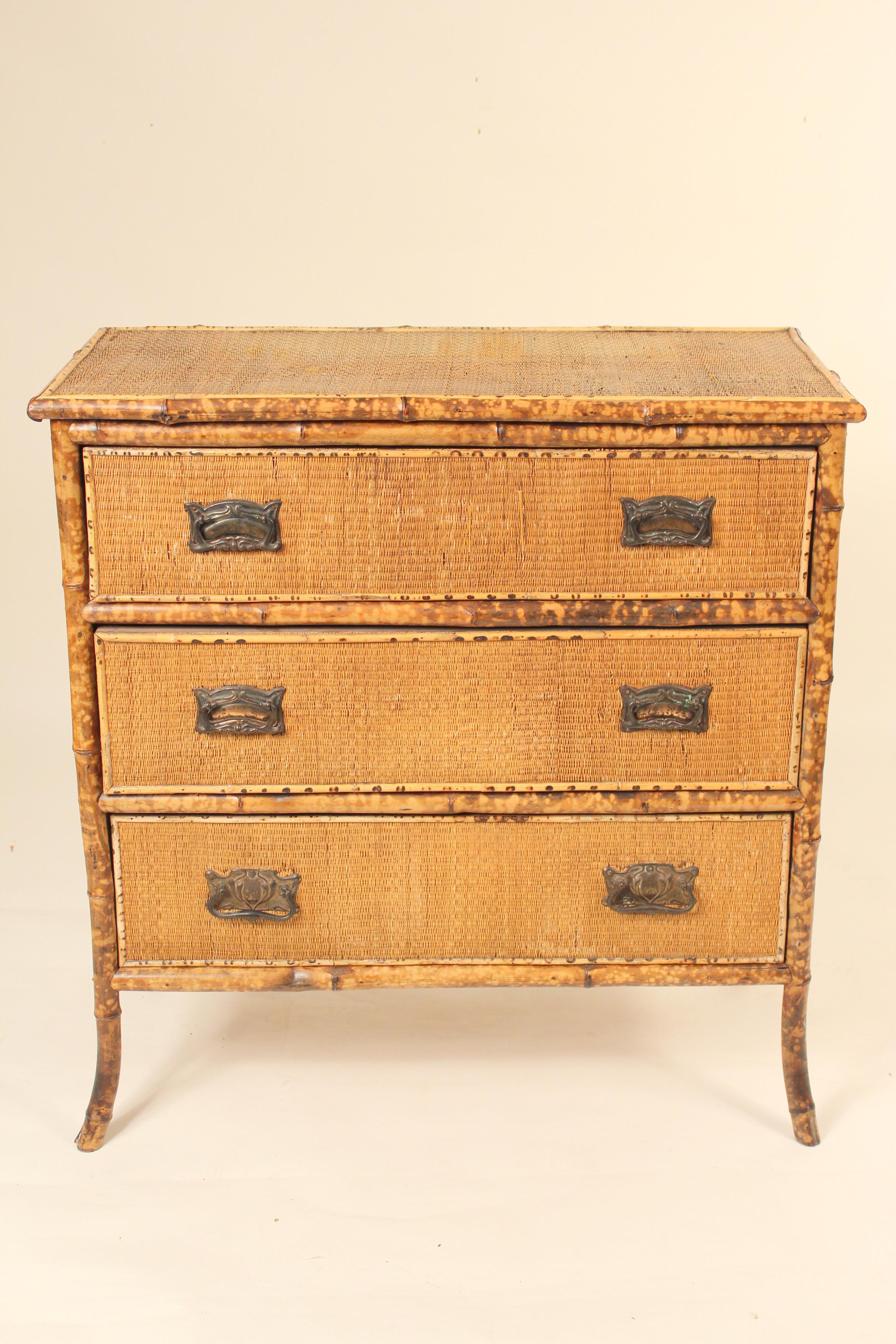 Bamboo and rattan chest of drawers with brass hardware, circa 1920s.