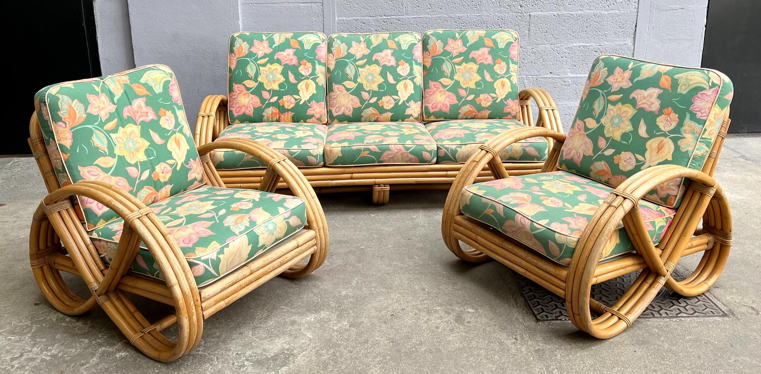 Living room set comprising a three-seater sofa and a pair of bamboo and rattan armchairs, with their seat and back cushions in good condition, covered with their original fabric.

Dimensions of the sofa: Width: 184 cm (72.4 inches /6.04 feet);