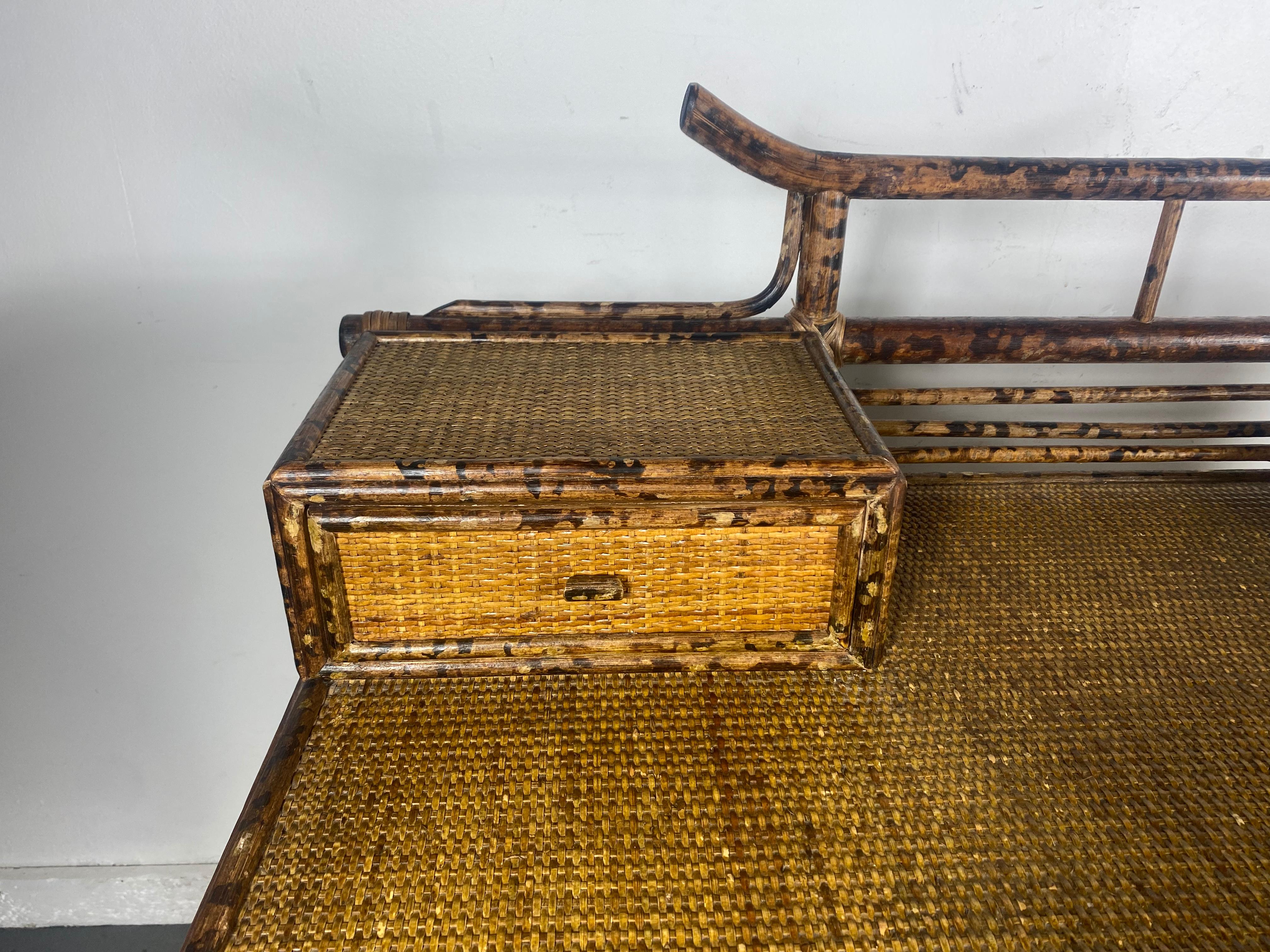 Bamboo and rattan writing desk features Asian chinoiserie style,,,4 drawers,,, Made for Bloomingdale's. Very good condition with minor imperfections,,, some wrapping (see photo) back height 40