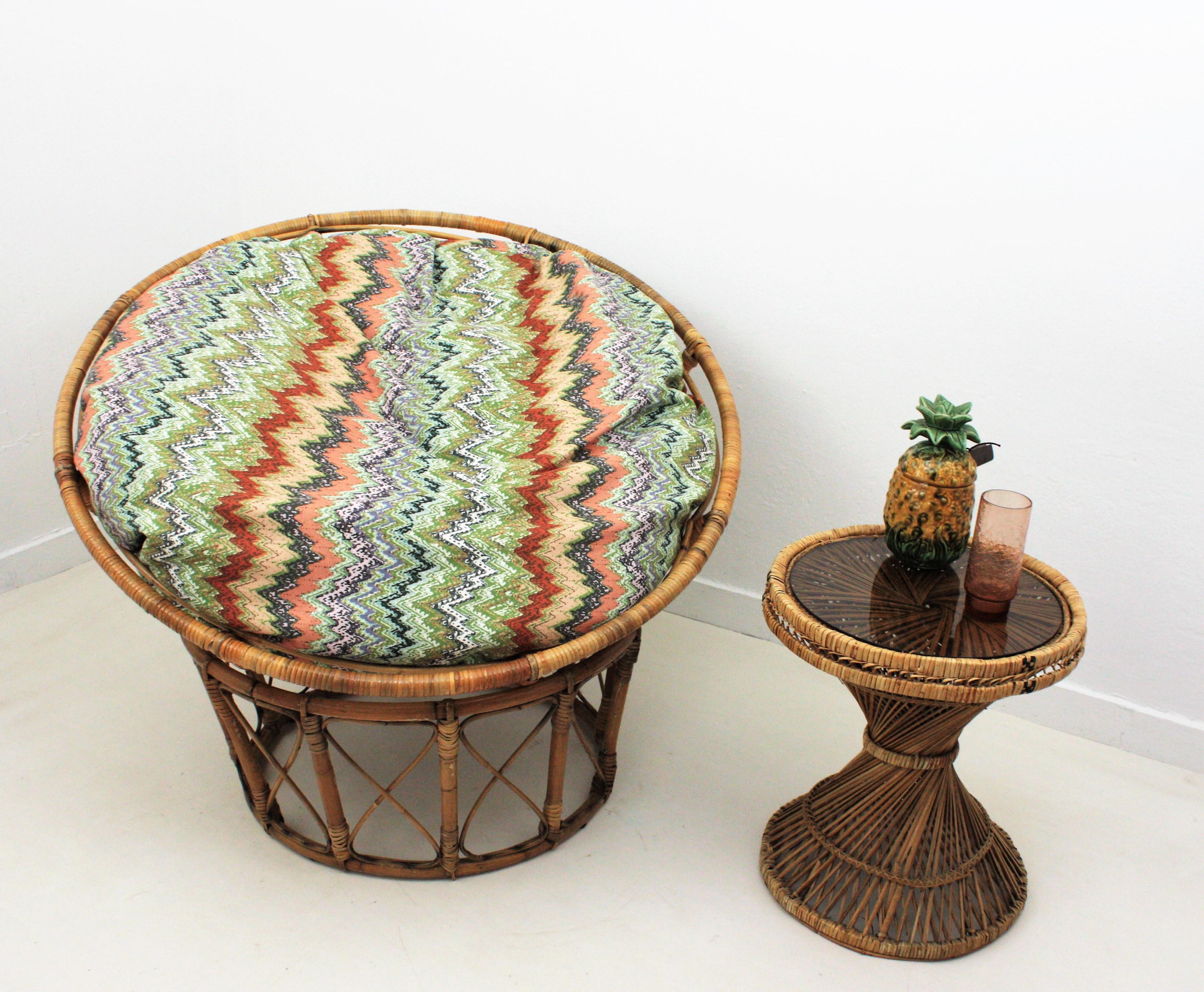 Huge bamboo and rattan Papasan chair with colorful Missoni striped cushion, Philippines, 1950s-1960s.
This eye-catching and comfortable swivel lounge chair is constructed with bamboo and rattan canes creating a concentric circles