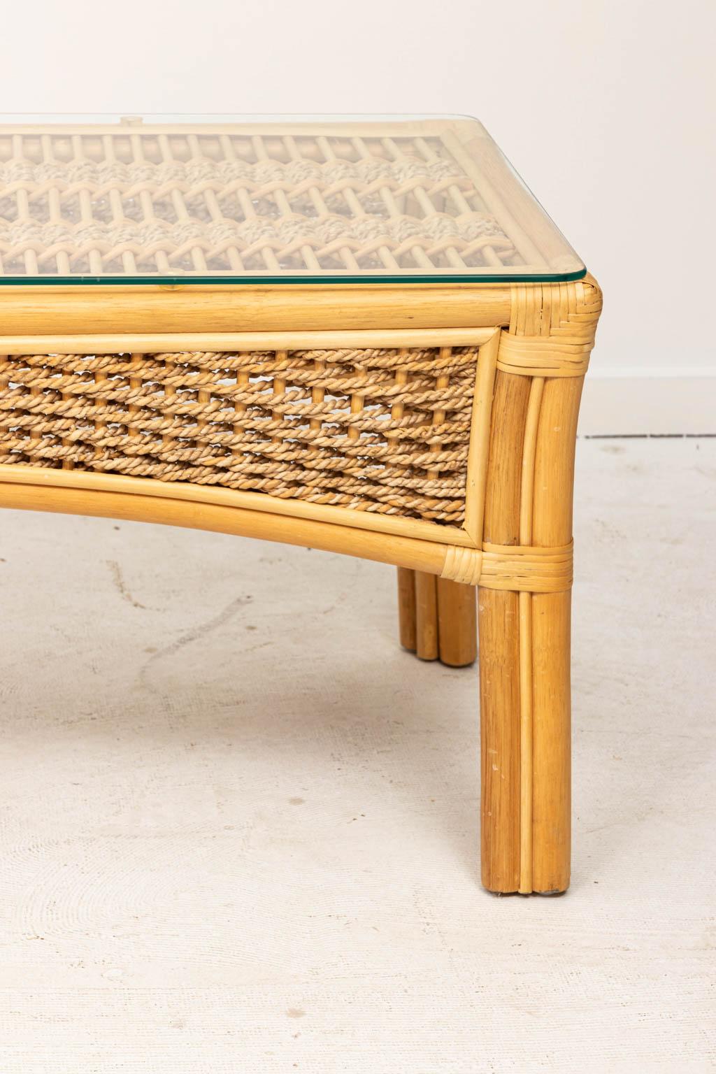 Bamboo and rope coffee table with glass top, circa 1990s. Please note of wear consistent with age. Made in the United States.