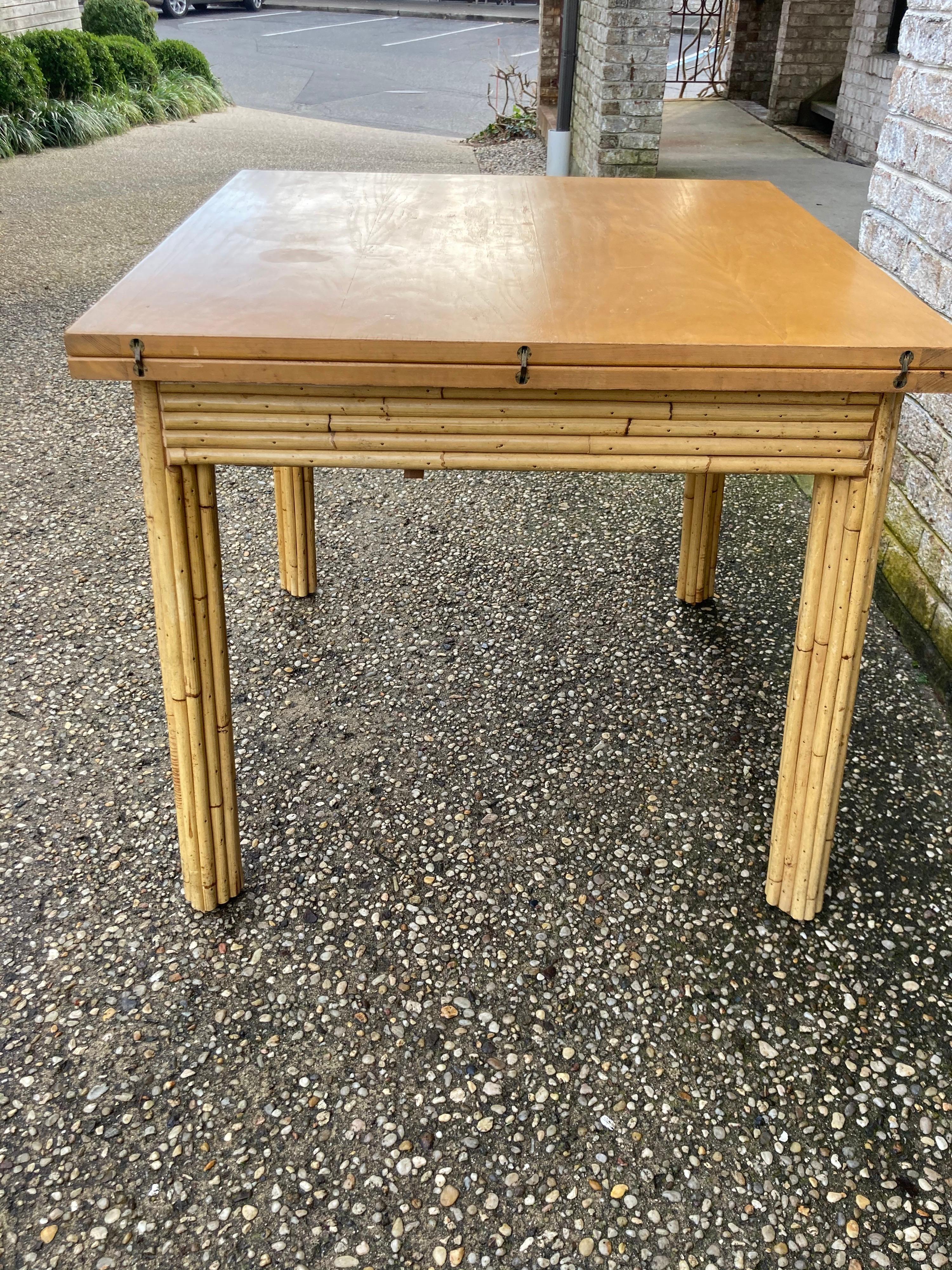 Very tropical reed or bamboo table with the top hinged to flip and slide into place to make larger .... table top is 32