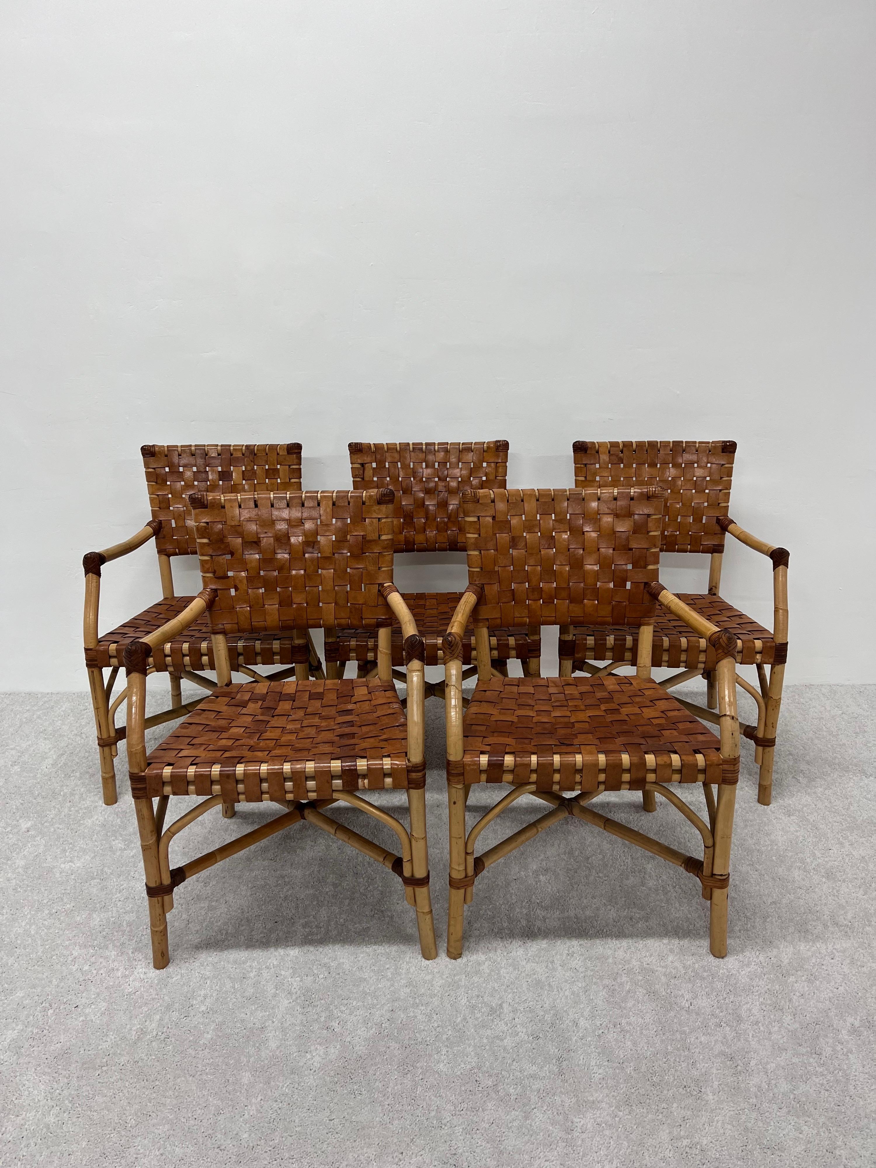 Set of five woven leather and bamboo dining arm chairs from the 1970s.

Measures: arm height: 26.5