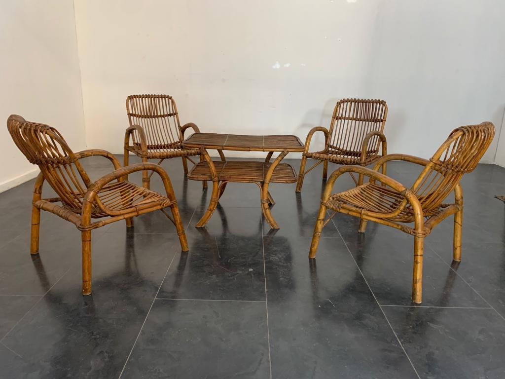 1960s bamboo set 4 armchairs with coffee table, 2 free fabric and metal vase baskets.
Armchairs 76hx54x73p seat 33
coffee table 56hx82x56.