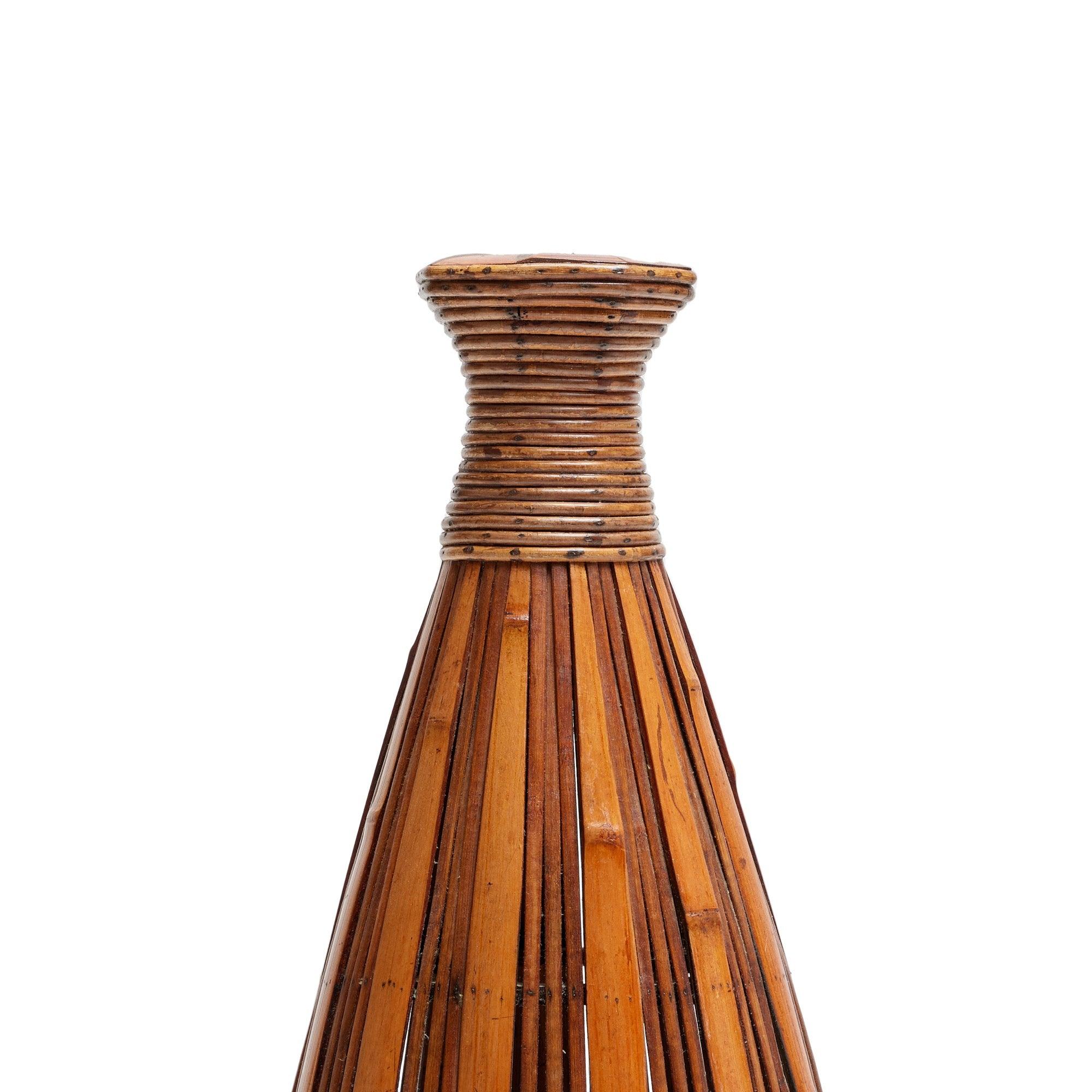 A tall bamboo basket sculpture.