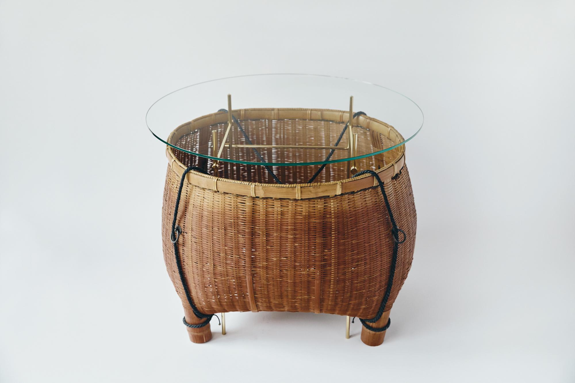 Table designed by Ryosuke Harashima.
This work is made of antique Japanese bamboo basket and steel and glass.
Artist create new style table by combining old tool which is never used now and Industrial materials. It has both contemporary feeling