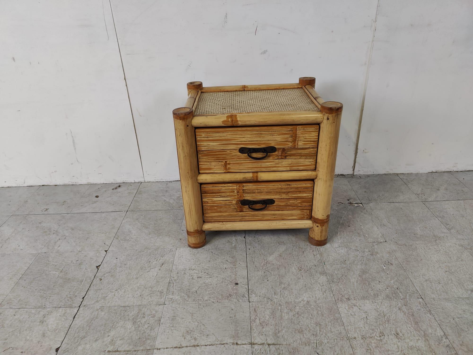 Elegant two drawer bamboo bedside cabinet.

1970s - France

Dimensions:
Height: 47cm/18.50