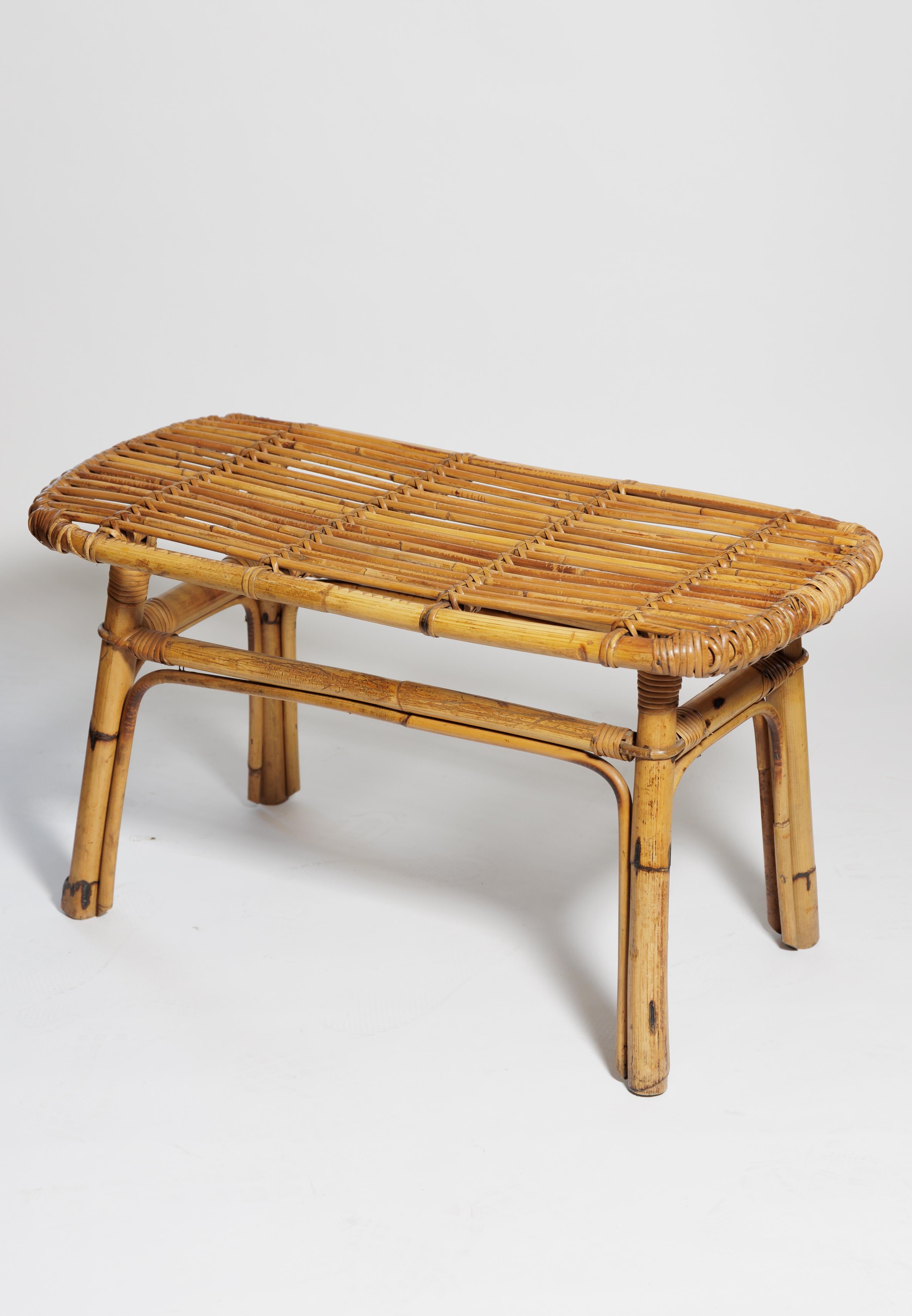 A lovely rattan bench can also be used as a table as well as seating.