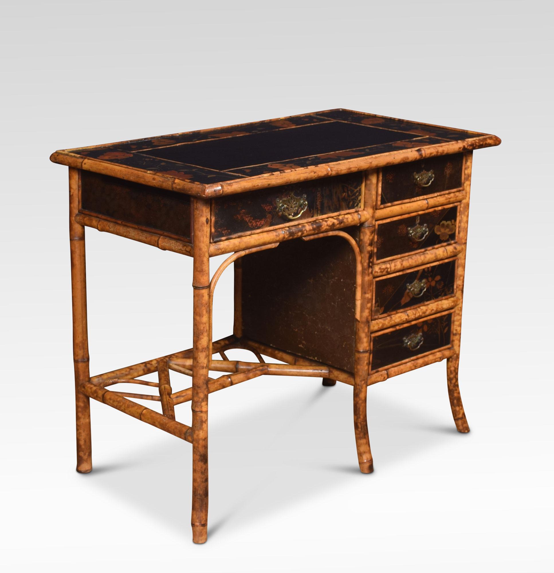 19th century bamboo black lacquered writing desk having black leather inset writing surface above an arrangement of draws, with painted floral detail. All raised up on splayed bamboo legs united by cross stretchers.
Dimensions:
Height 30