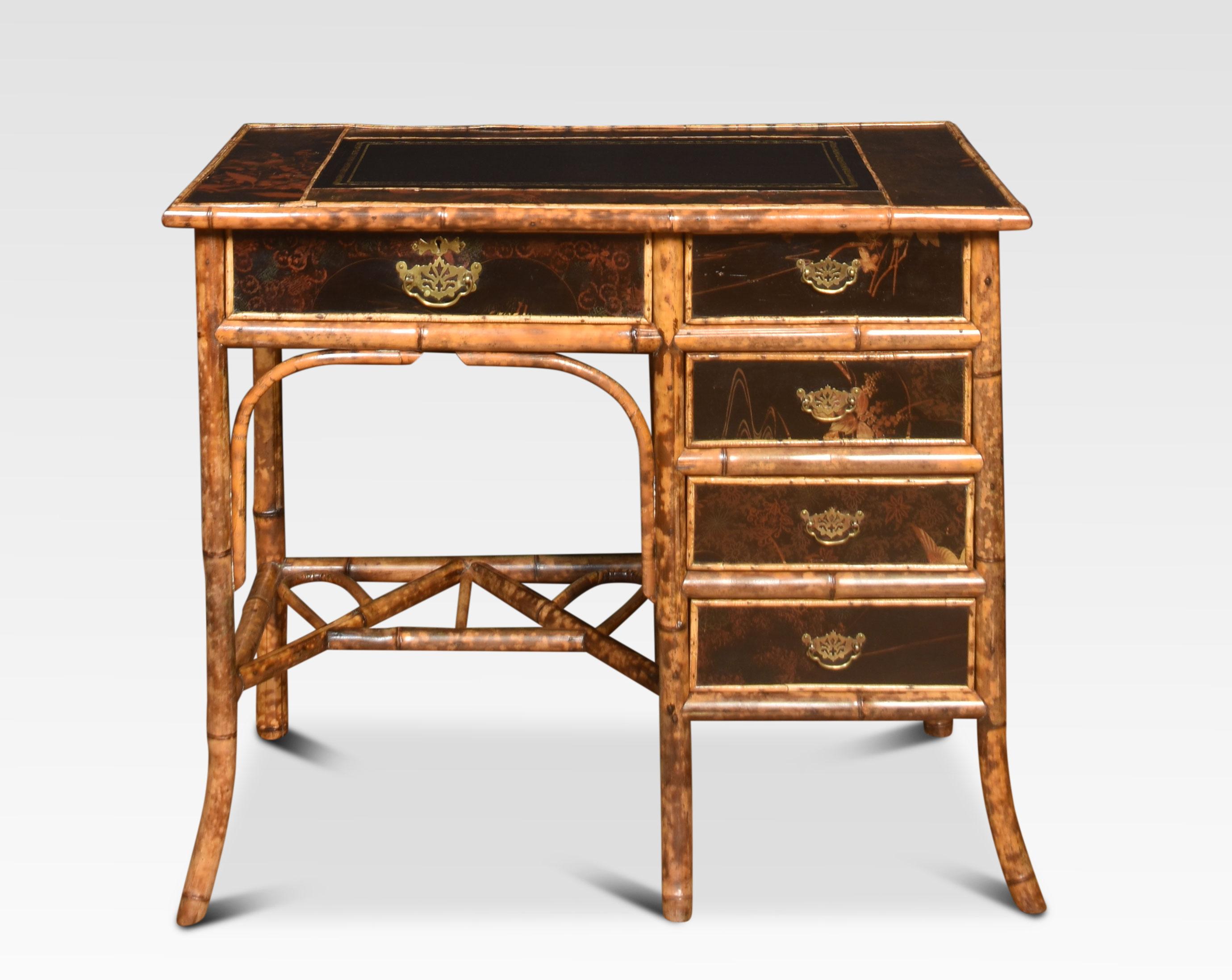 19th-century bamboo black lacquered writing desk having black leather inset writing surface above an arrangement of drawers, with painted floral detail. All raised up on splayed bamboo legs united by cross stretchers.
Dimensions
Height 29.5