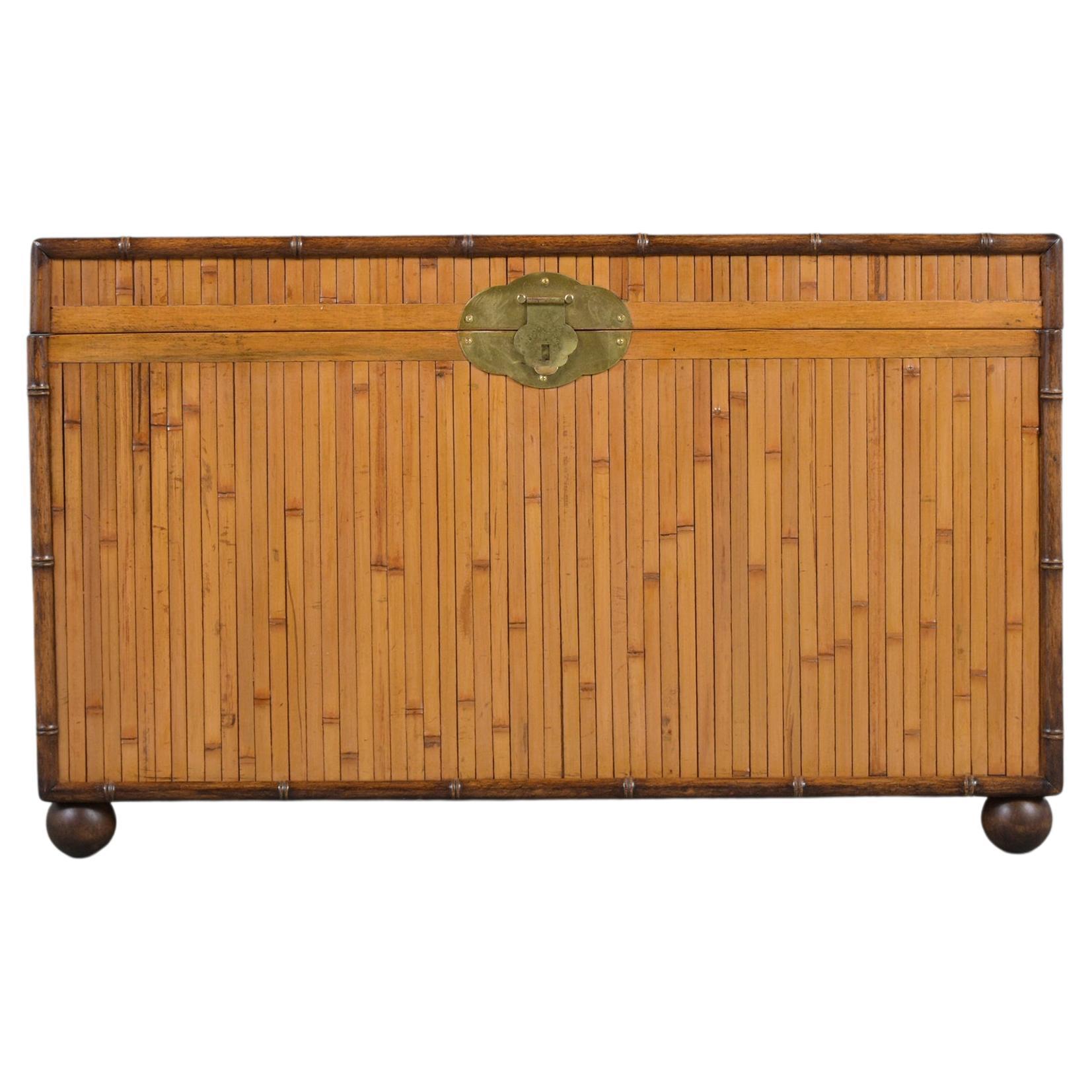 An extraordinary 1980s trunk crafted out of bamboo and wood is in a good condition and covered in bamboo featuring its original golden color and walnut finish. The trunk is newly shellacking, waxed, and polished developing a beautiful patina