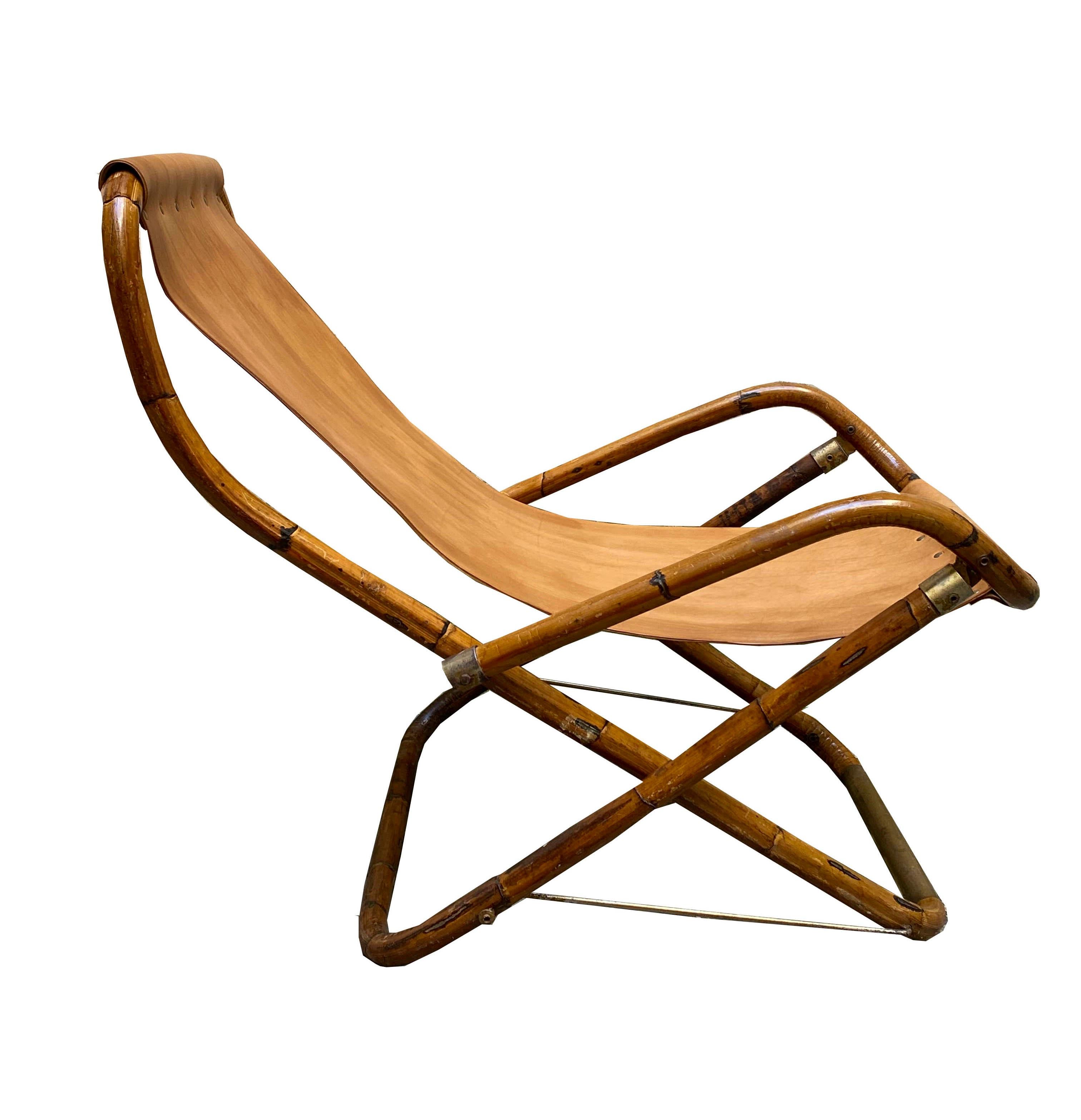 Folding lounge chair made of bamboo, leather and brass inserts produced in Italy in the 1960s.
 
