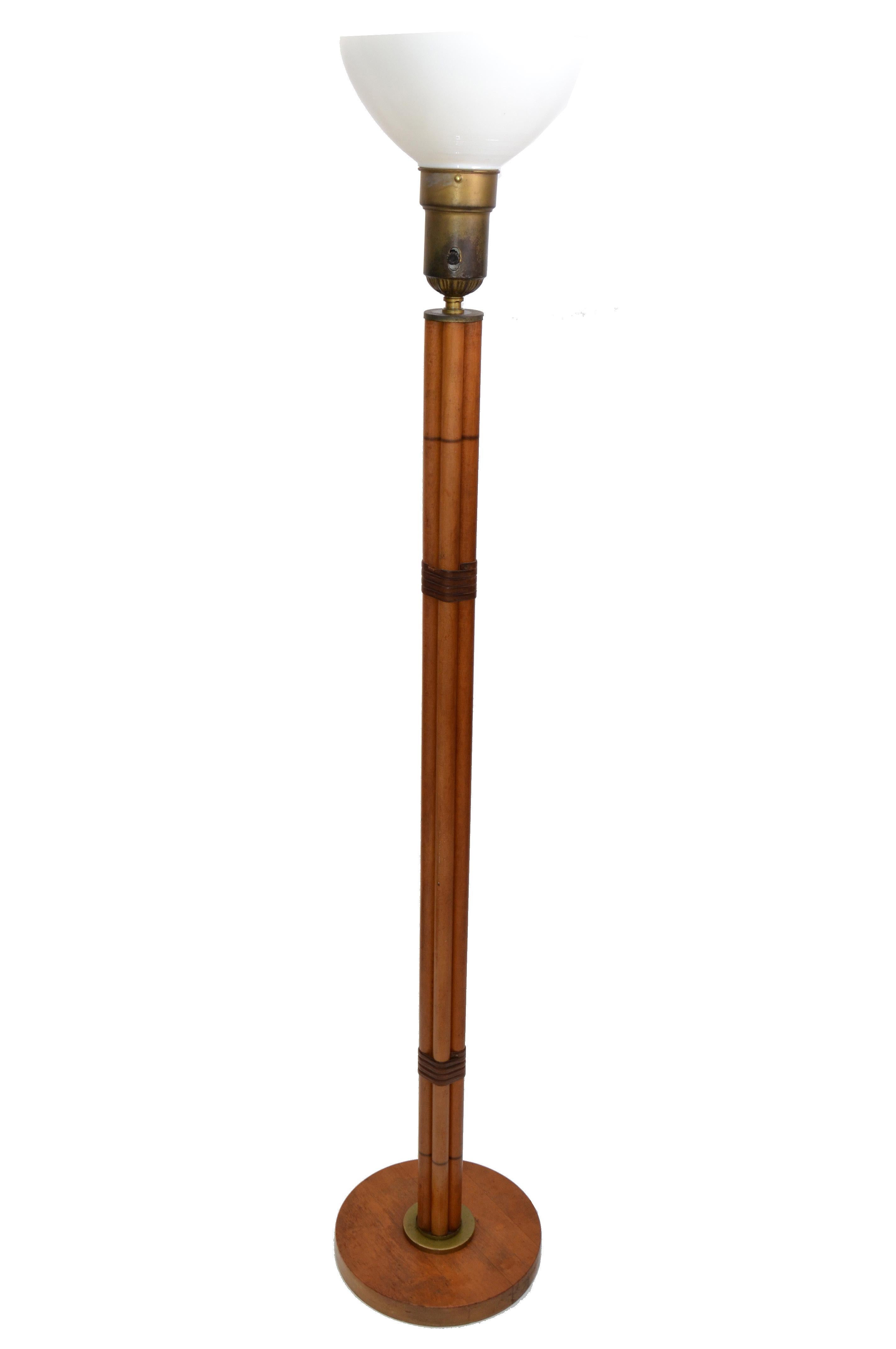 Handcrafted tall Mid-Century Modern bamboo and leather floor lamp with brass details and milk glass globe.
Is wired for the U.S. and uses a max. 60 watts light bulb.
Great addition for Your Sunroom.