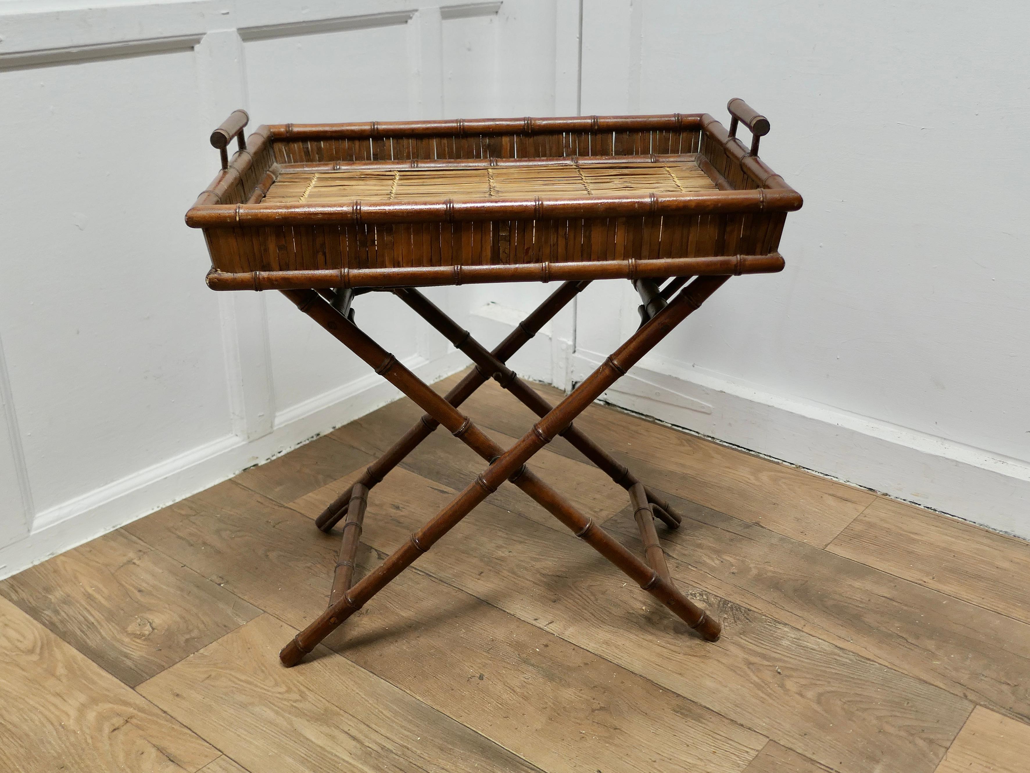 Bamboo Butlers Tray on Stand

This is a superb quality piece, the tray top fits on to the folding legs forming a neat drinks table 
The frame of the tray and stand are made in faux bamboo and the rest of the tray is made in woven split bamboo
