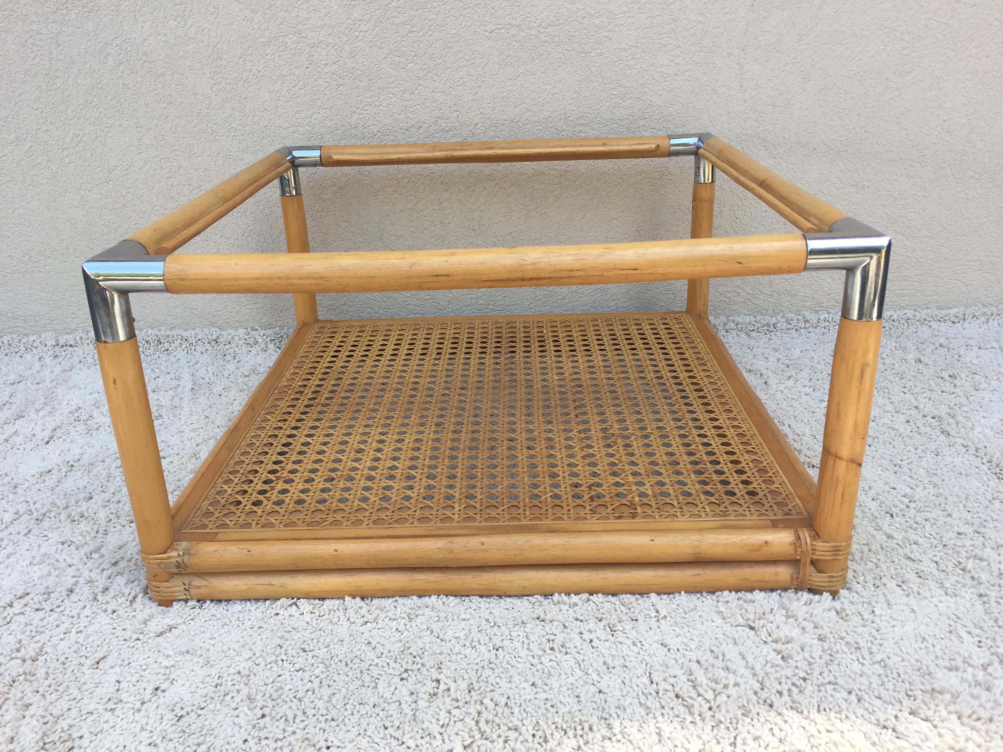 Bamboo cane woven shelf chrome corner midcentury glass top coffee table.